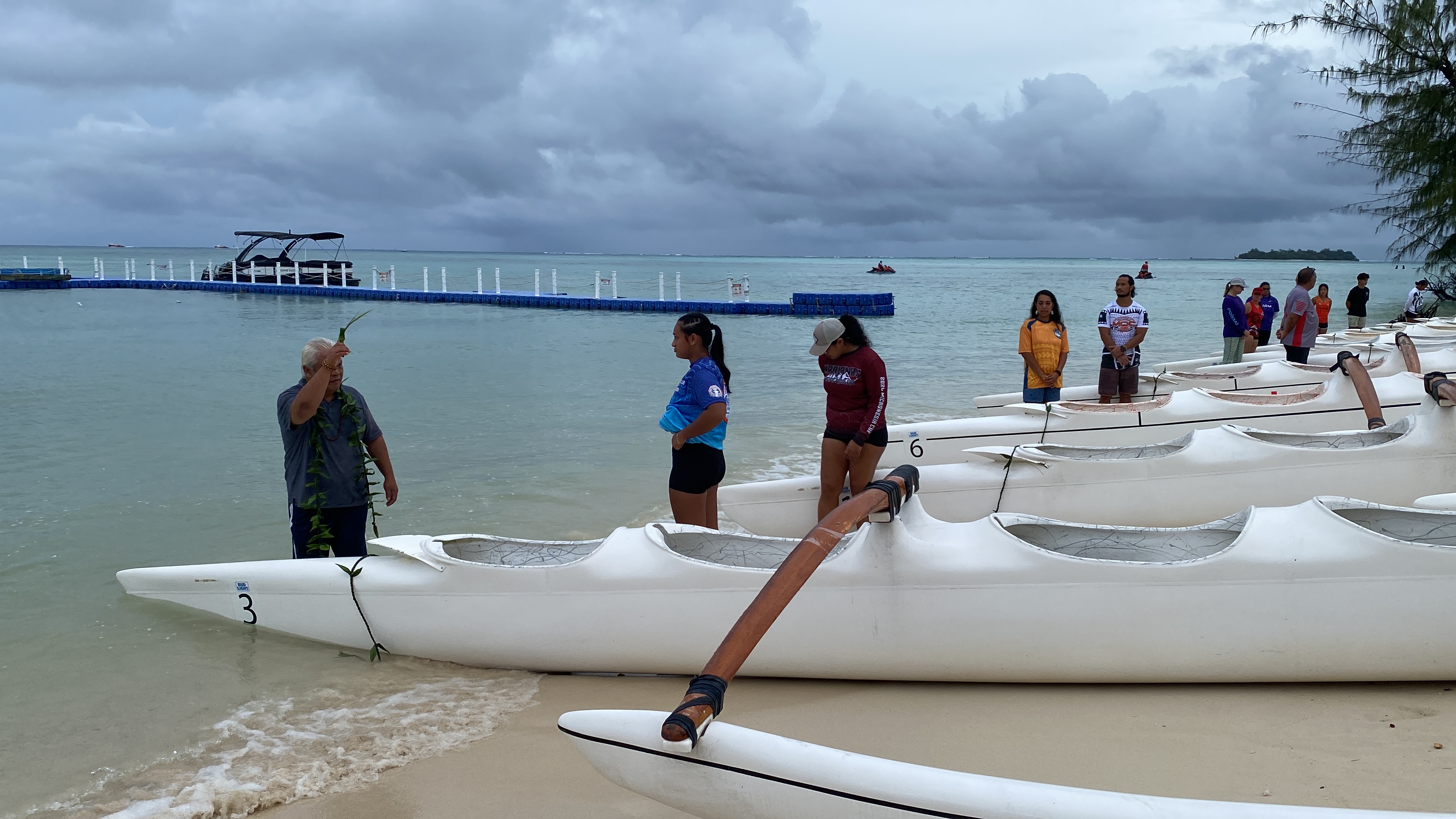 Donald Mendiola, local healer, blesses a racing va'a prior to the start of the Micro Cup.