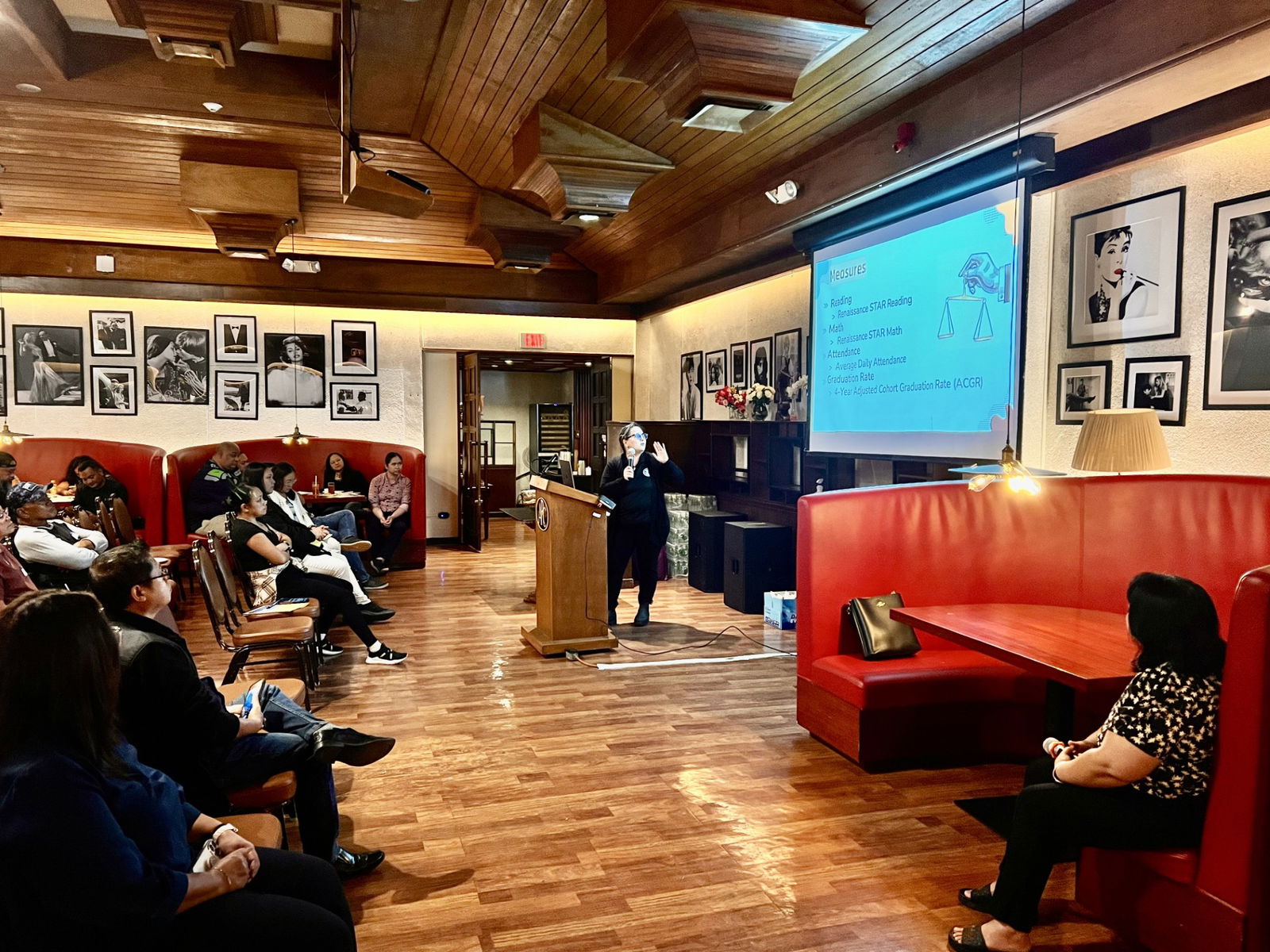 Celine Orsini of the PSS Accountability, Research and Evaluation Office presents the “School Accountability Report Card” to parents.