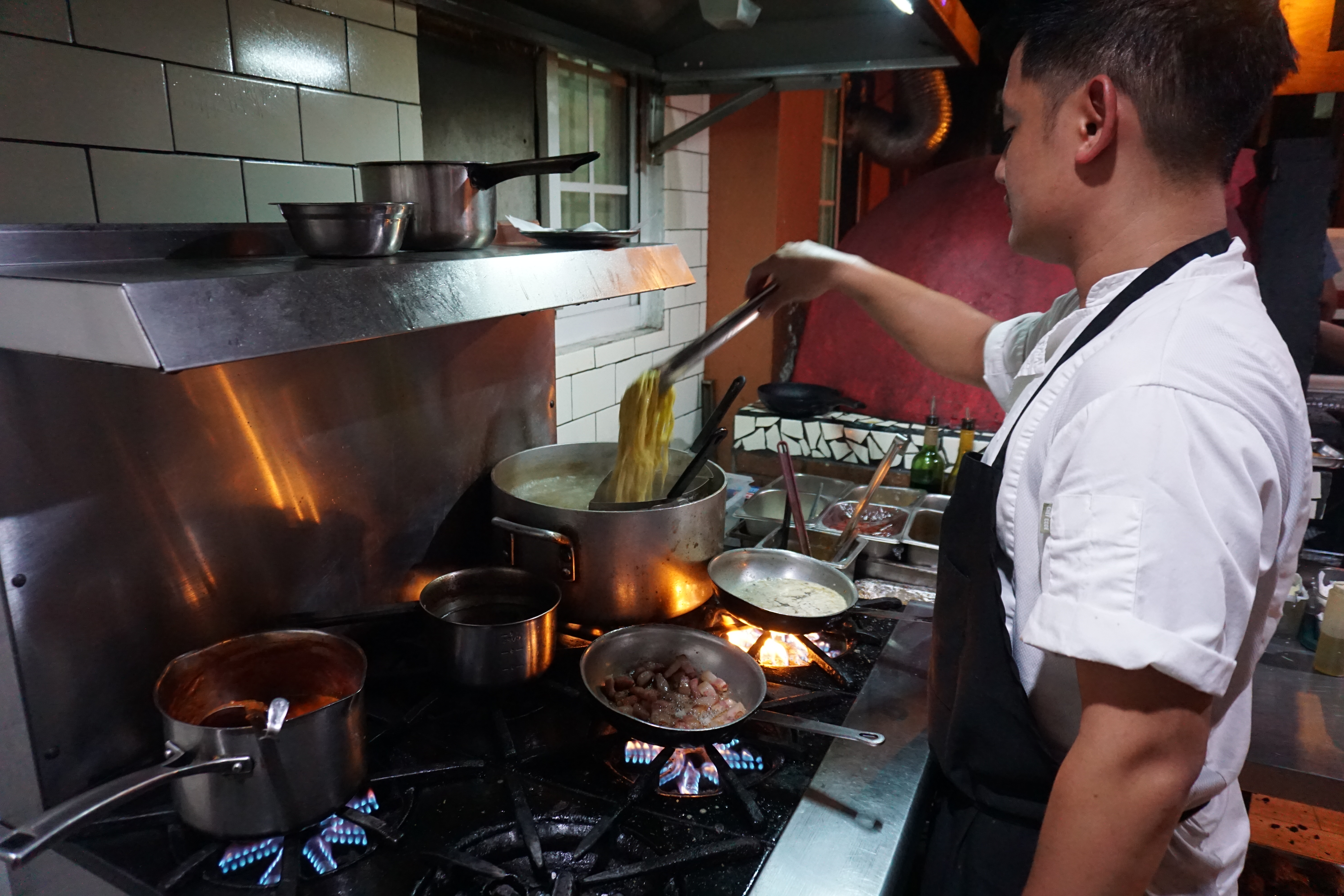 Chef Norman Chan is hard at work at Angry Penne.