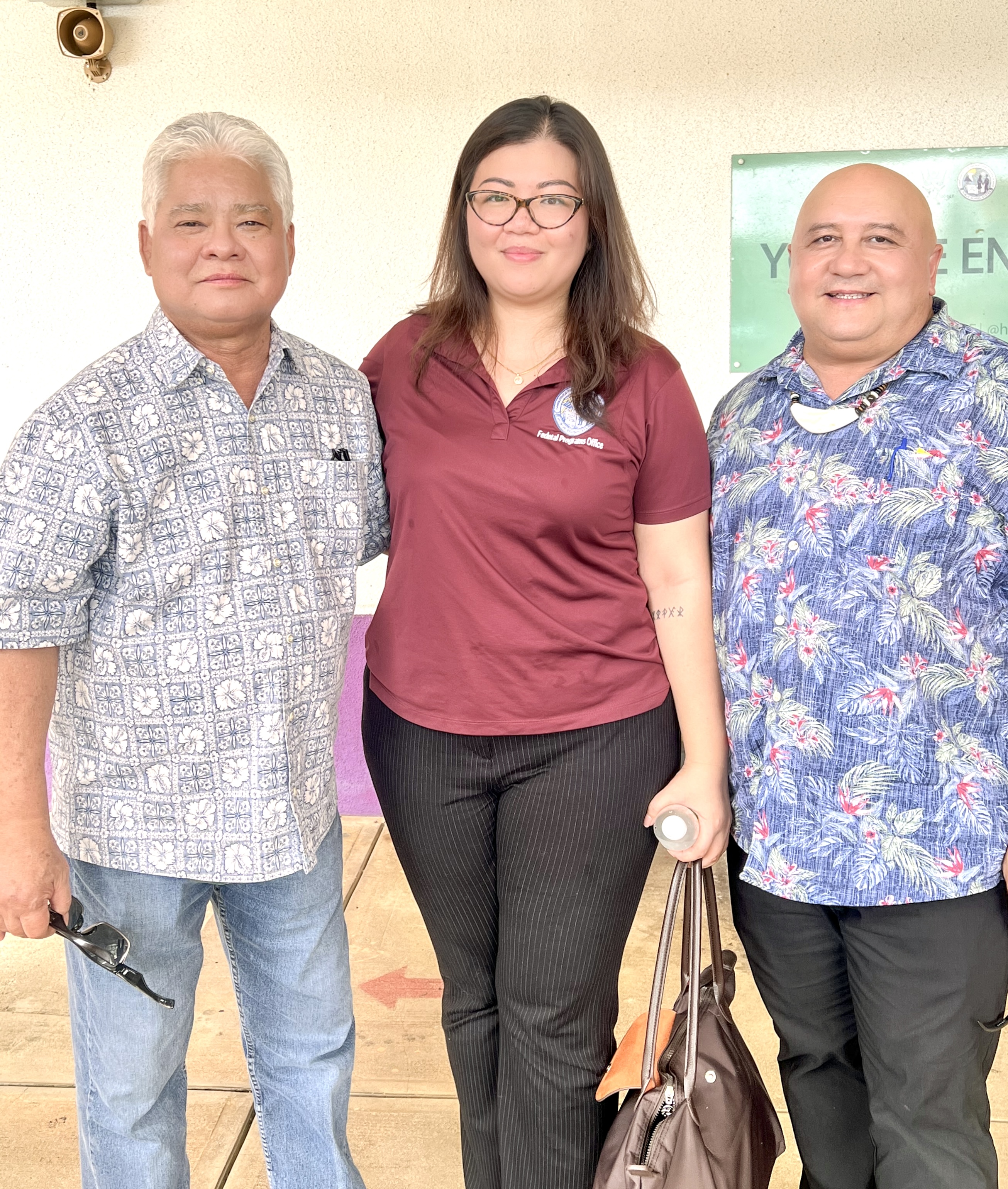 Gov. Arnold I. Palacios, Commissioner of Education Dr. Lawrence F. Camacho, and Public School System Federal Programs Officer Jacqueline P. Che.
