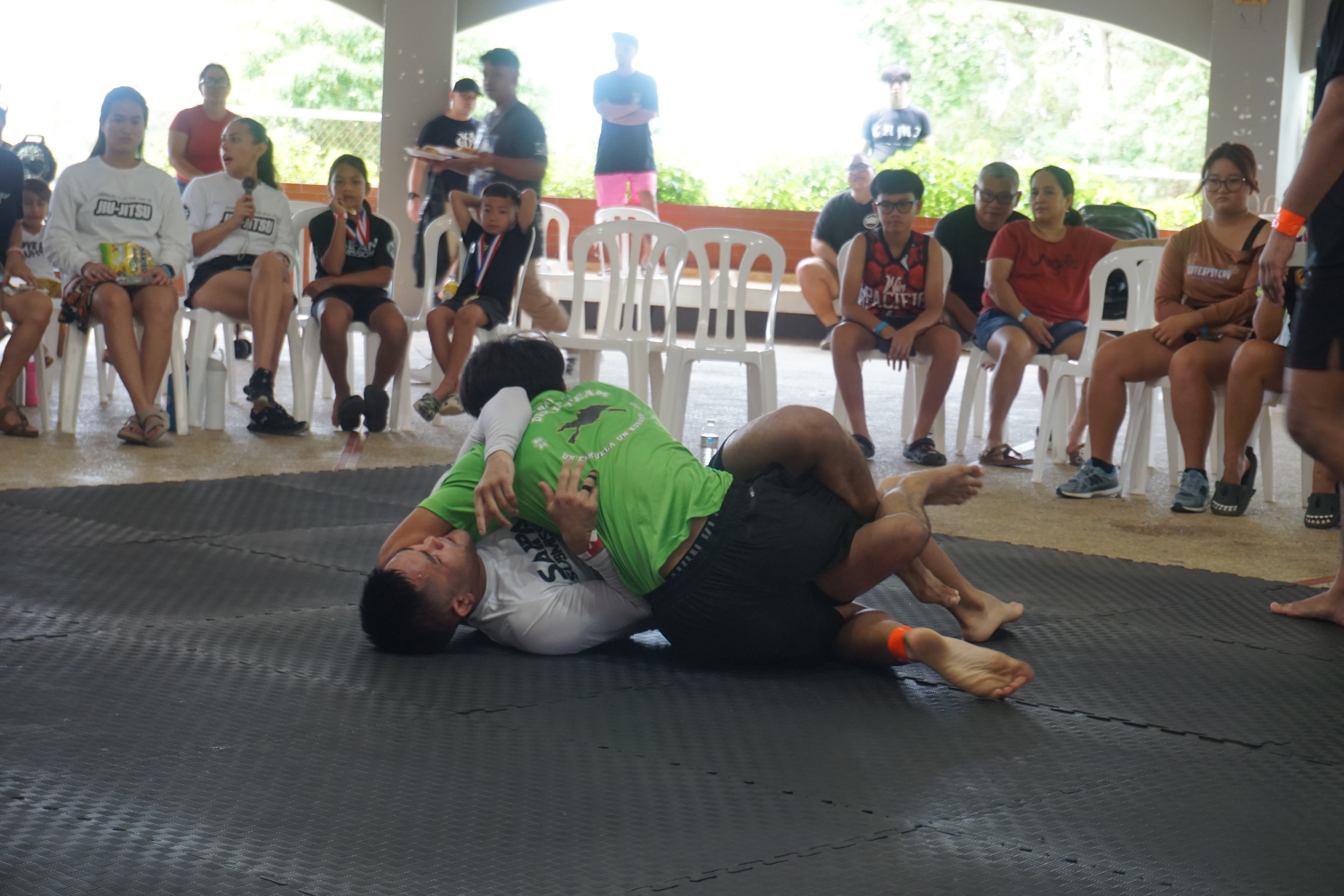 Jake Yamagishi, in white, fights off Mathew Salas.
