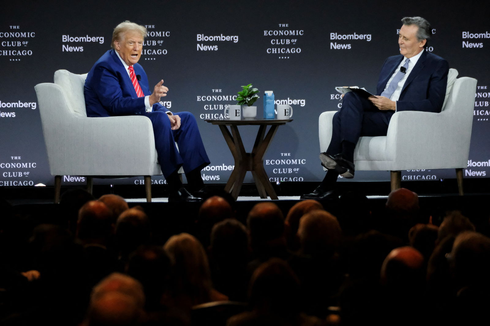 Republican presidential nominee Donald Trump speaks as he is interviewed by Bloomberg Editor-in-Chief John Micklethwait at the Economic Club of Chicago in Chicago, Illinois, Oct. 15, 2024. 