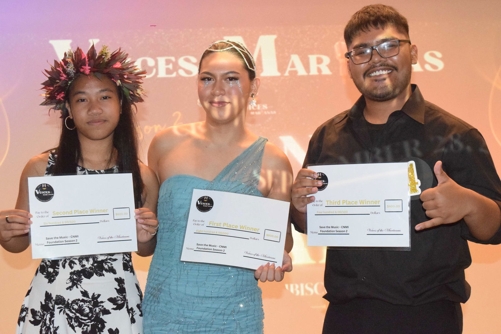 Franko Deleon Guerrero, center, Karlymae Lizama, and Jason Lizama display their awards at the conclusion of Voices of the Marianas Season 2 grand finale at the Crowne Plaza Resort's Hibiscus Hall on Saturday.