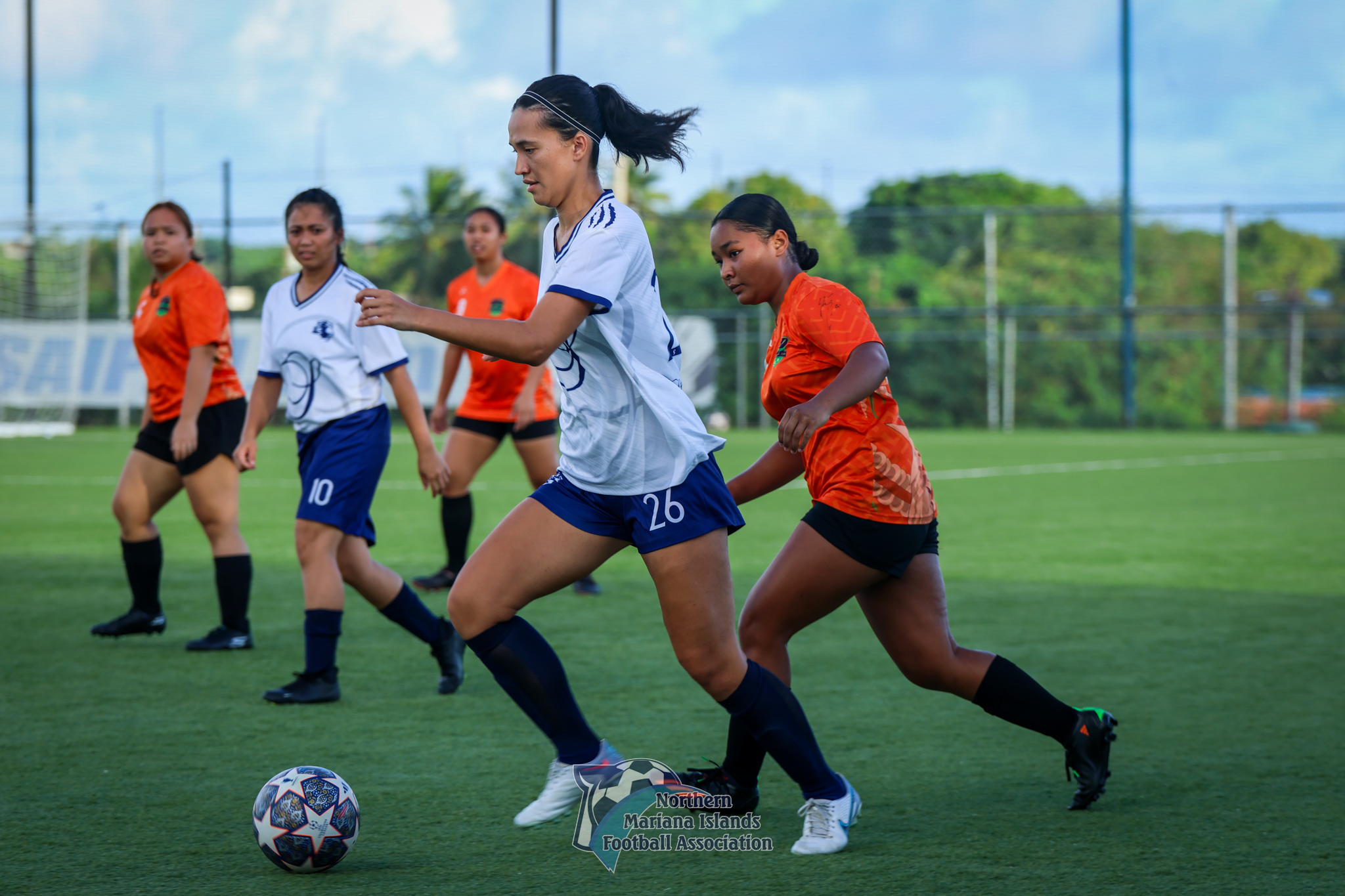 Shirley’s Bernadette Horey controls the ball as teammate Jeralyn Castillo and defenders looks on during a Division A game of the Dove Women’s League at the NMI Soccer Training Center in Koblerville on Sunday.