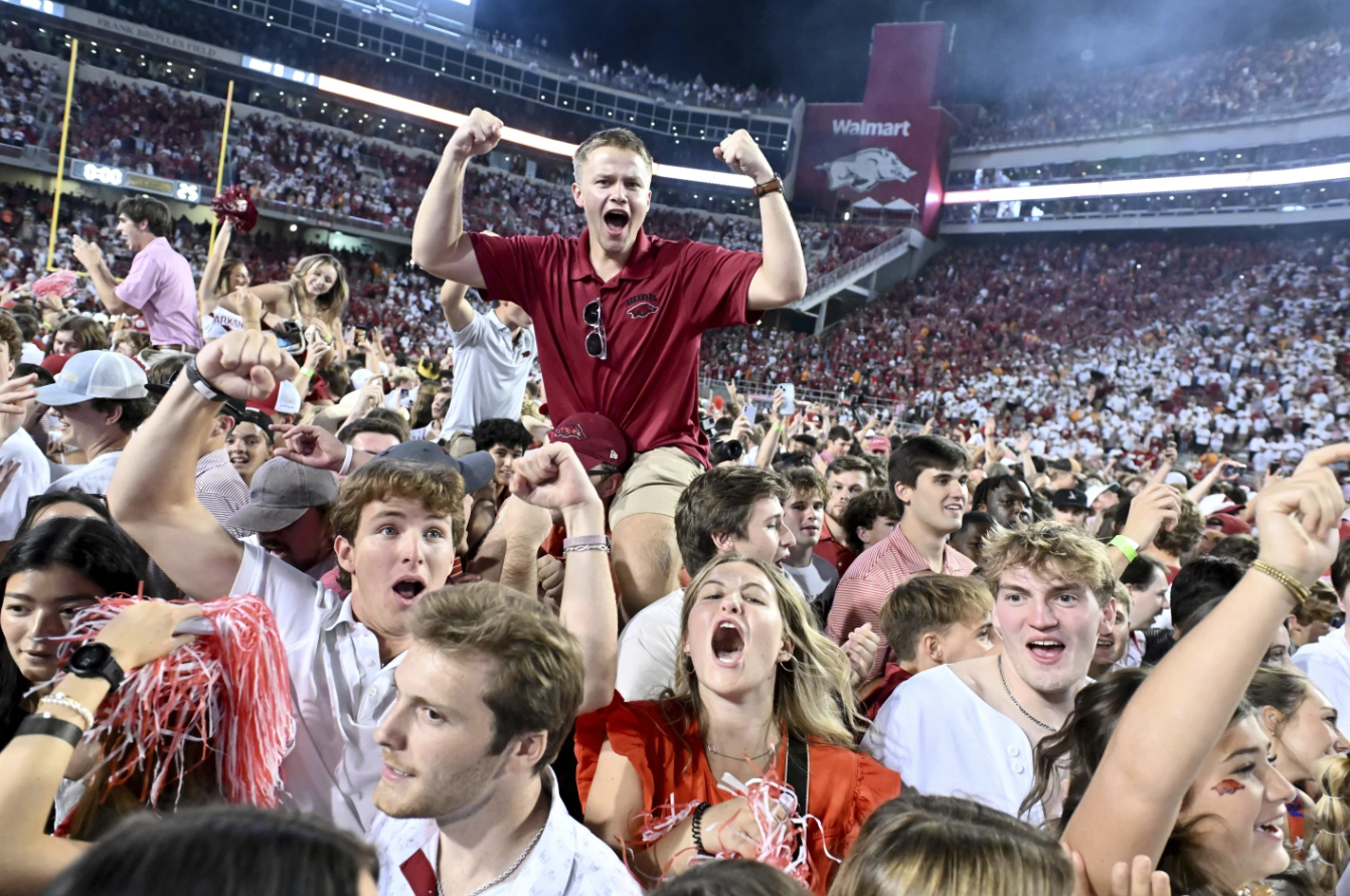 Arkansas fans celebrate after their team defeated Tennessee 19-14 during an NCAA college football game Sunday, Oct. 5, 2024 in Fayetteville, Ark.