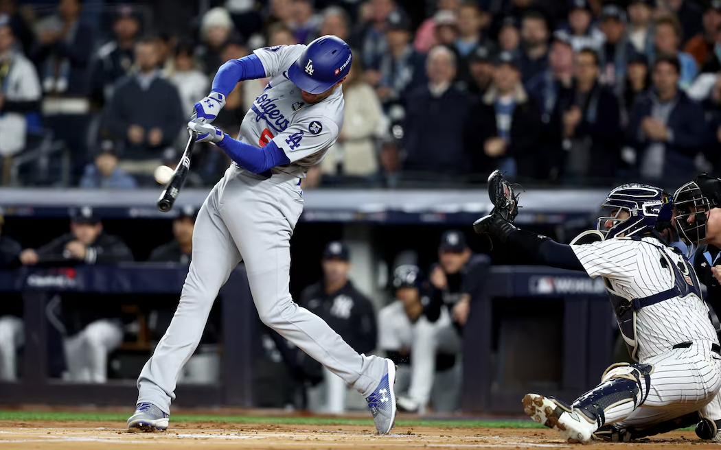 Los Angeles Dodgers first baseman Freddie Freeman (5) hits a two-run home run during the first inning in game three of the 2024 MLB World Series against the New York Yankees at Yankee Stadium in New York, Oct. 28, 2024.