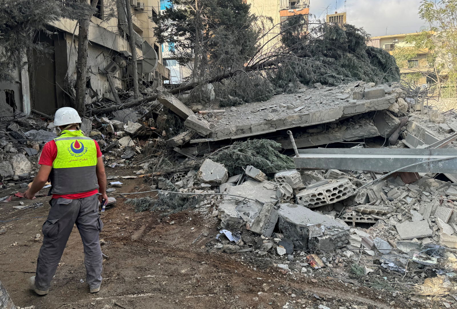 A civil defense member of the Islamic Health Authority walks at a site damaged in an Israeli strike in Nabatieh, amid the ongoing hostilities between Hezbollah and Israeli forces in southern Lebanon Oct. 16, 2024.