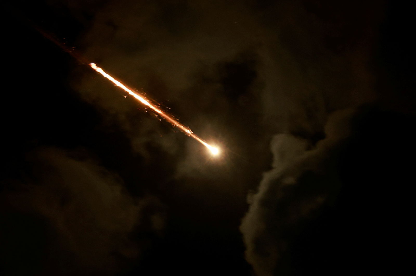 A projectile is seen in the sky after Iran fired a salvo of ballistic missiles, amid cross-border hostilities between Hezbollah and Israel, as seen from Tel Aviv, Israel, Oct. 1, 2024.
