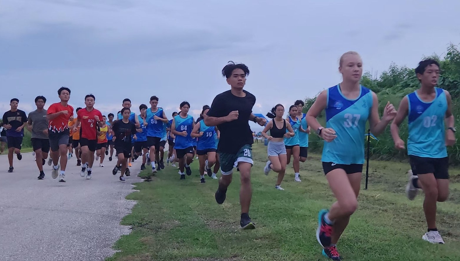 The high school division runners take off during the third qualifying round of the Public School System’s All-Schools Cross Country event at Banzai Cliff on Saturday.