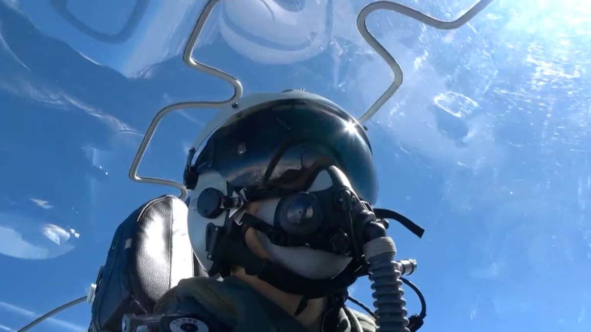 A member of Chinese People's Liberation Army sits in an aircraft during the "Joint Sword-2024B" military drills around Taiwan, from an undisclosed location in this screenshot from a handout video released by the PLA Eastern Theatre Command on Oct. 14, 2024.