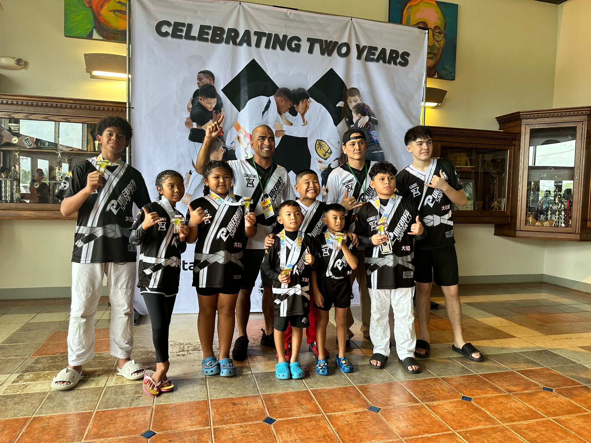 Trench Tech team members pose with the medals they won in the Patgon Jiu Jitsu Tournament Fall 2024 at the Father Duenas Pheonix Center, Guam, on Saturday. 