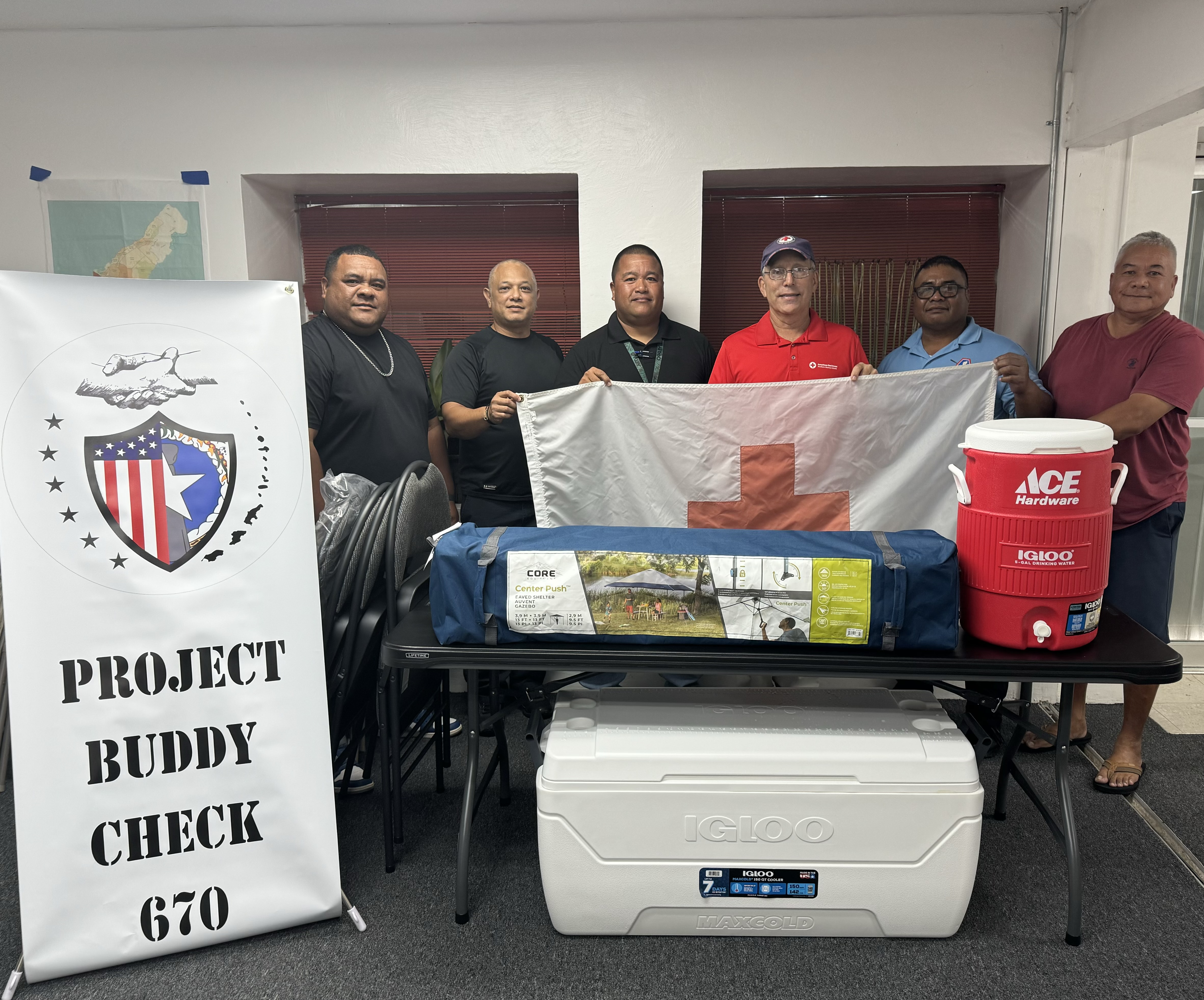 Harley Eriich, Barry Maratita, Cristin Duenas, Jess Stole, and John Cepeda of PCB670 with John Hirsh, executive director of the American Red Cross-NMI Chapter.        