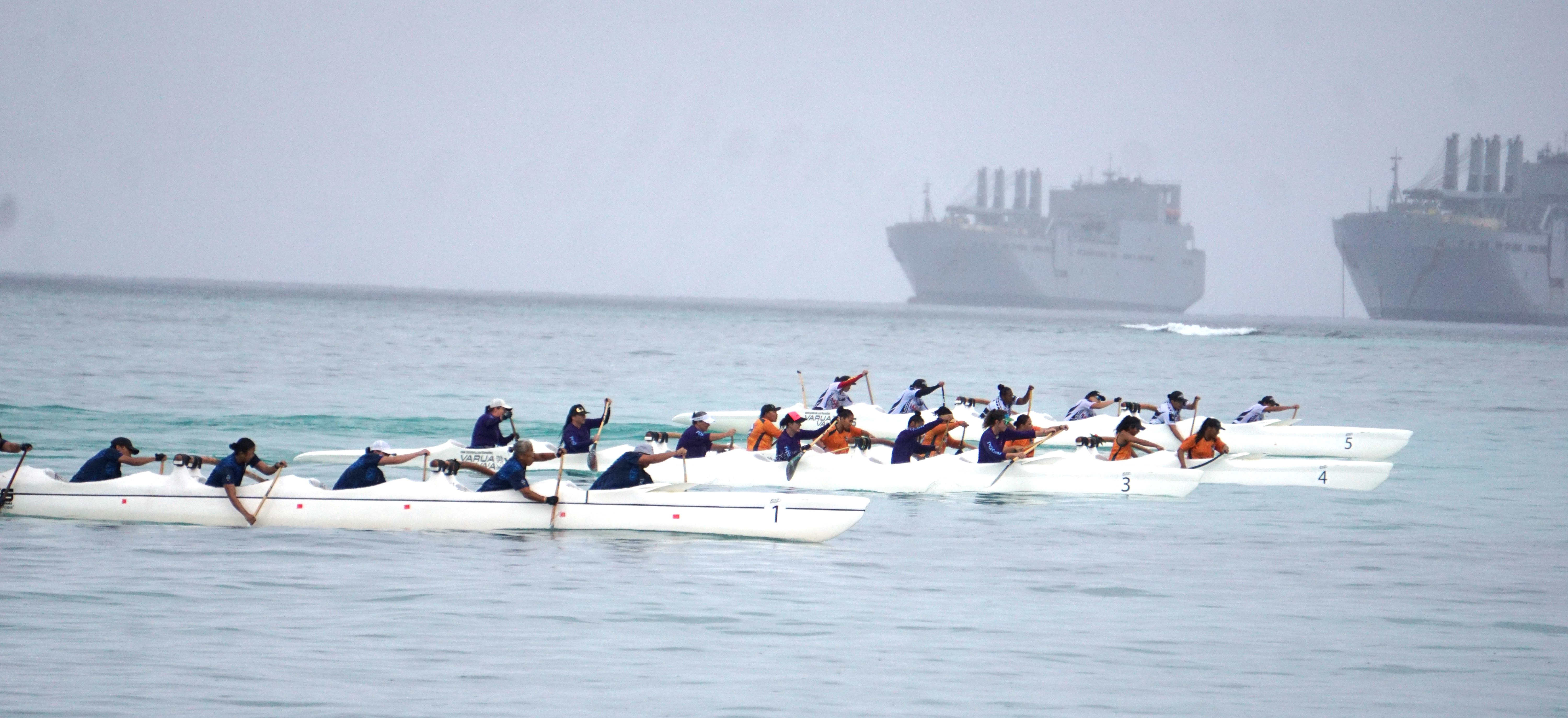 Participating teams vie for the lead during a masters women's race in V6 long distance division of the 24th Micronesian Cup at the Crowne Plaza Resort Saipan beach on Saturday. 