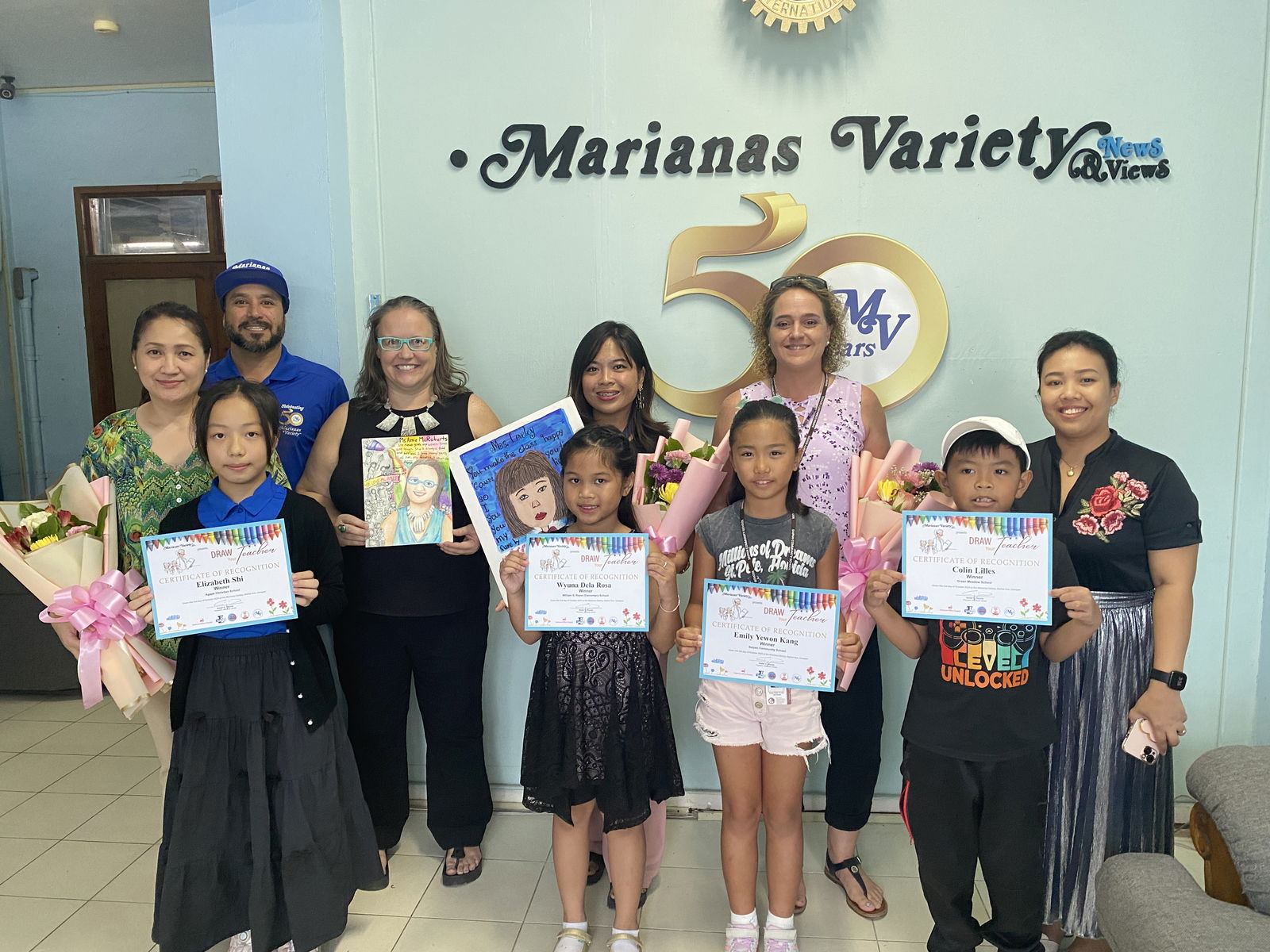 Marianas Variety President Amier Younis, back row, poses with the winners and their teachers. 