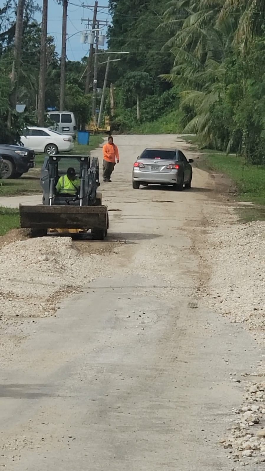  Saipan Mayor’s Office personnel repair a road in Chinatown on Sunday.