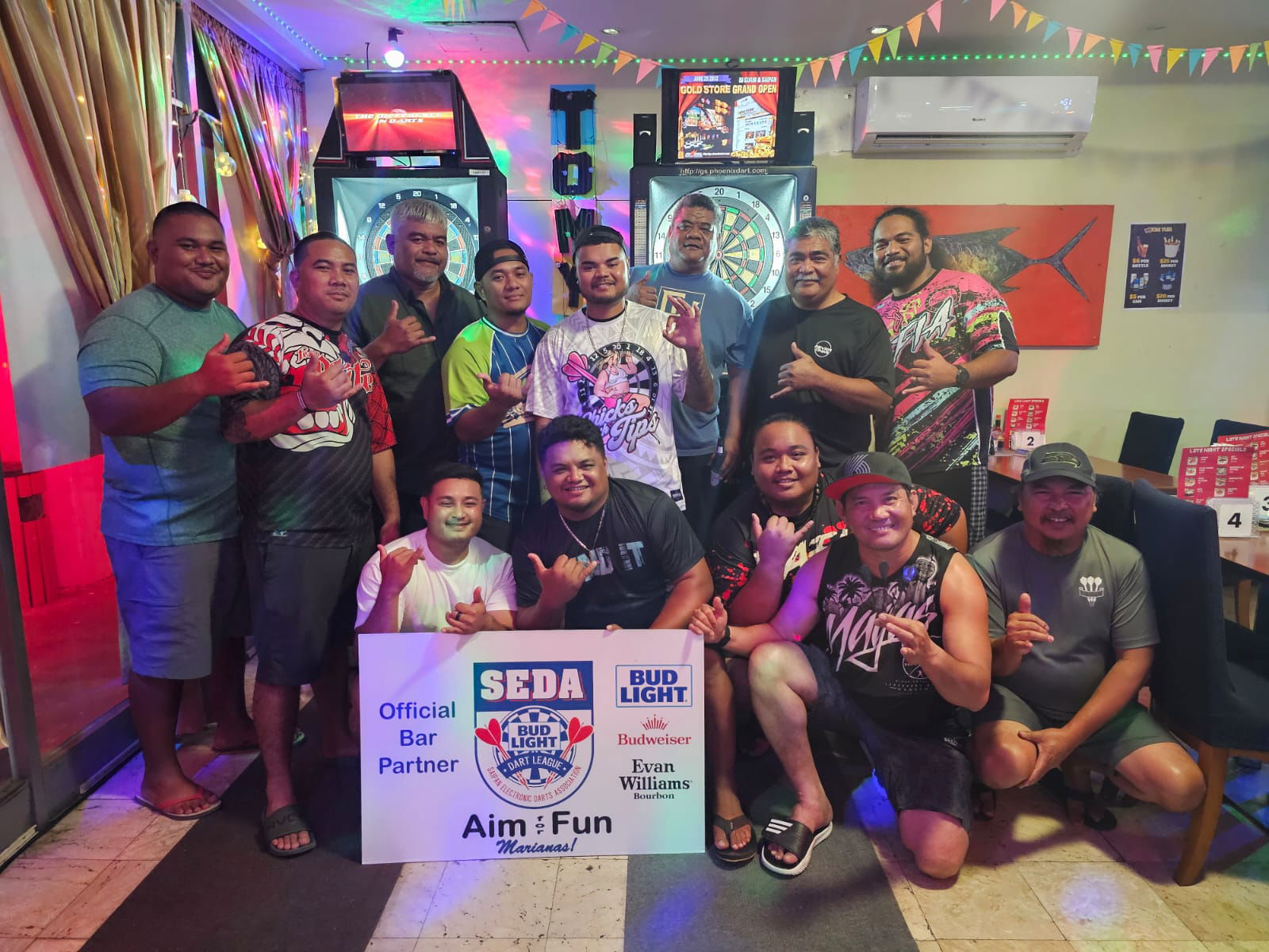 Flamingo Mafia and Tom Yum Dartty North players pose for a photo after an inter-government division game of the 2024 SEDA Bud Light Dart League at Tom Yum Restaurant.
