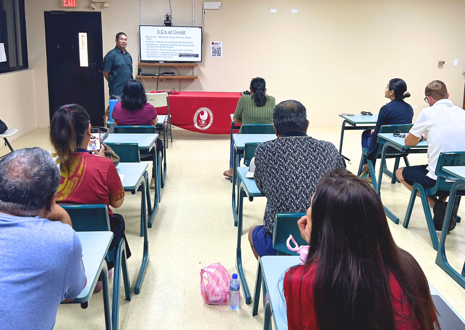 Kalistus Rengiil, Bank of Guam credit manager, makes a presentation to Rota SBDC clients at the NMC Rota Center.