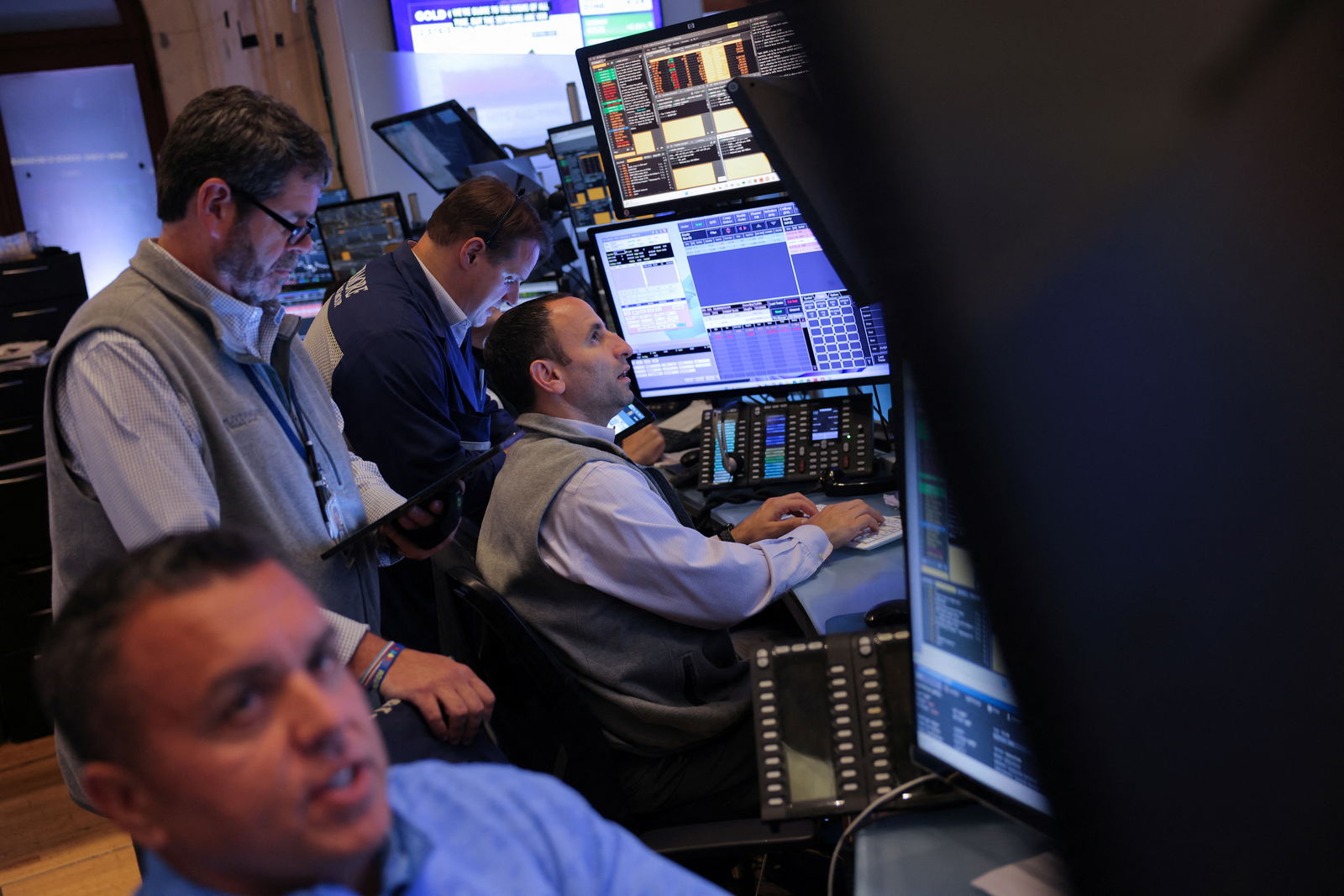 Traders work on the trading floor at the New York Stock Exchange following the Federal Reserve rate announcement, in New York City, Sept. 18, 2024.