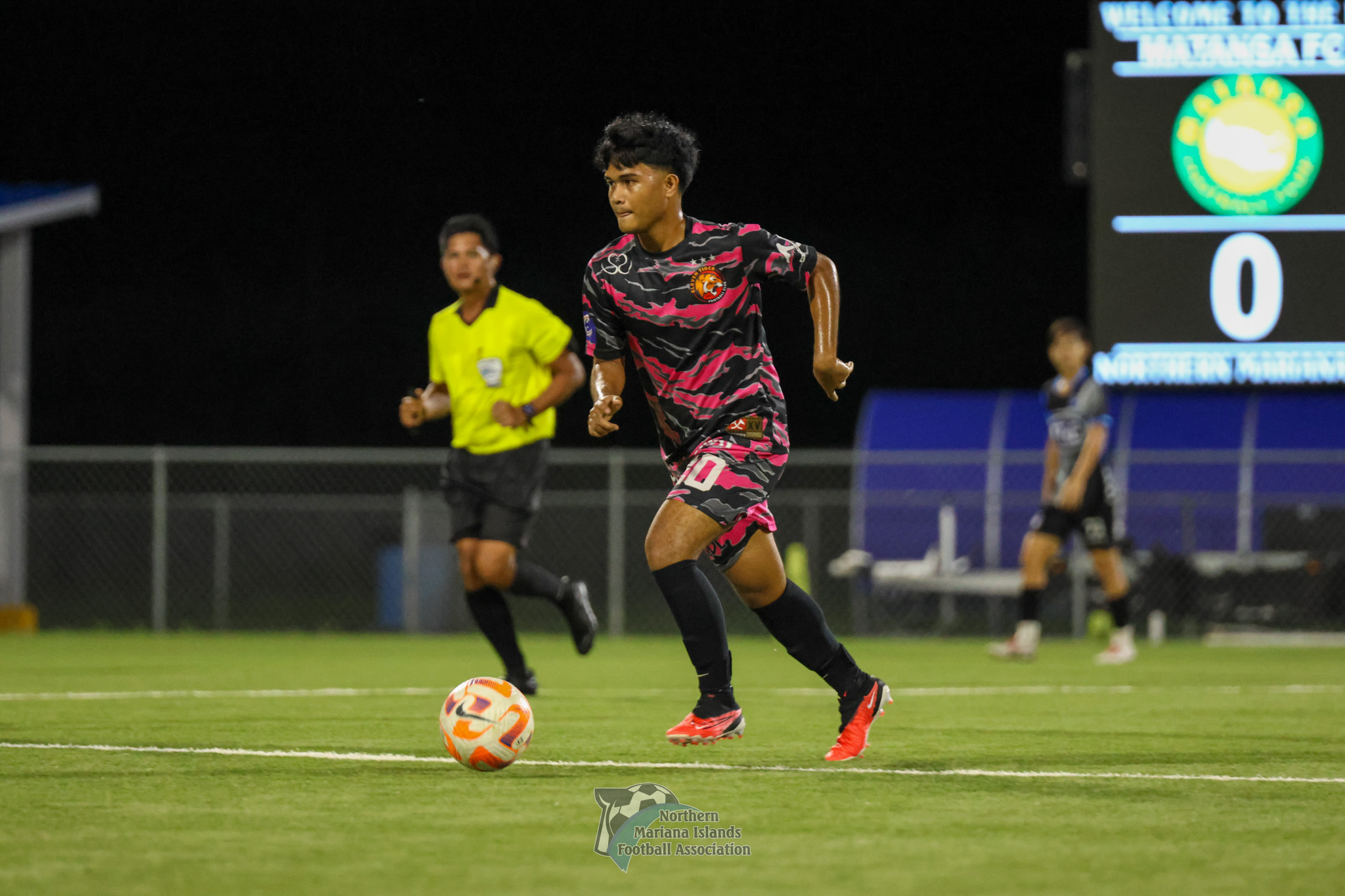 Matansa FC’s Brandon Tenorio dribbles forward as he sets up the play during a Marianas Soccer League 1 game at the NMI Soccer Training Center. 