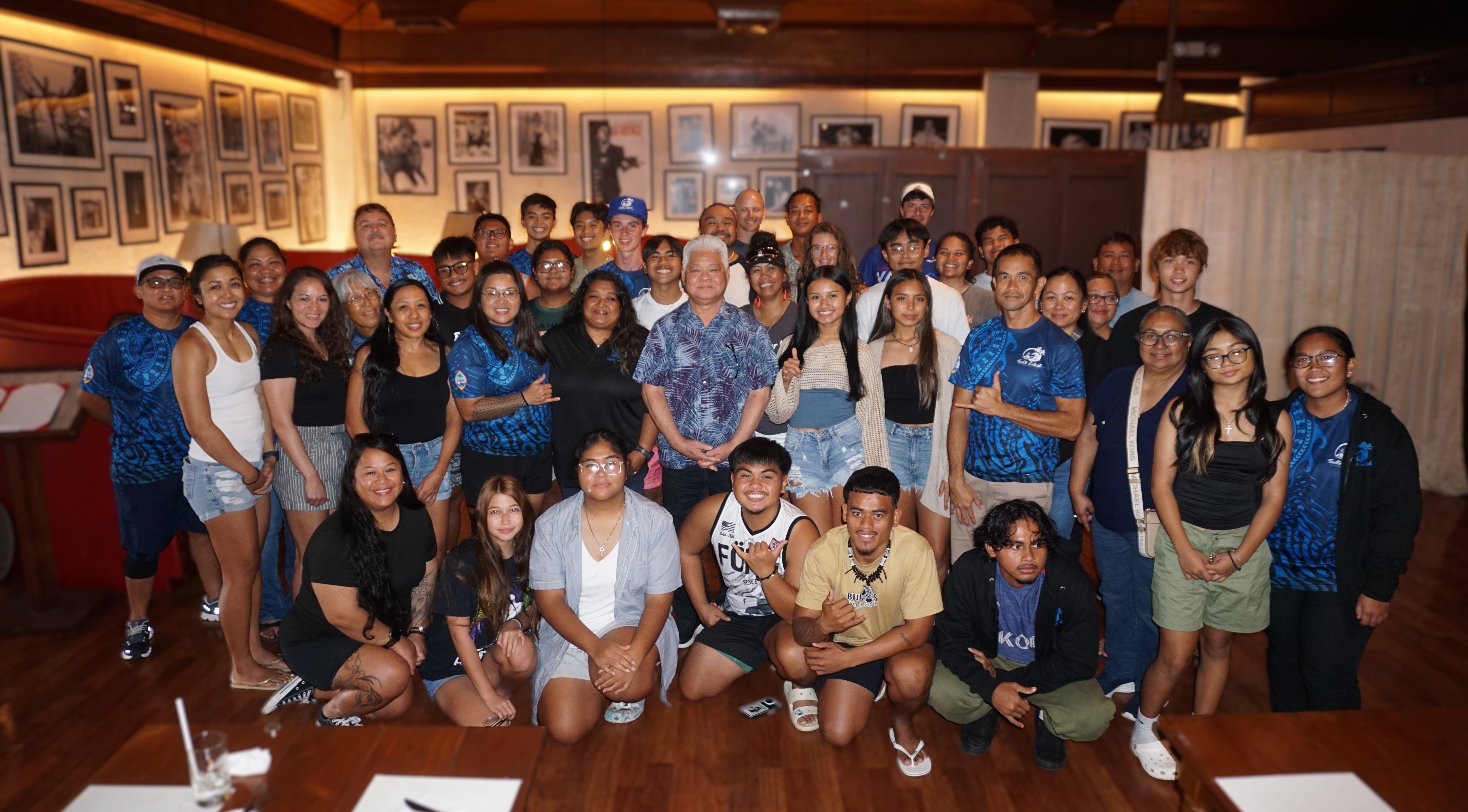 Governor Arnold I. Palacios, center, poses with the TaoTao Galaide paddlers of Guam during a lunch reception at the Aqua Resort Club Saipan on Thursday. 