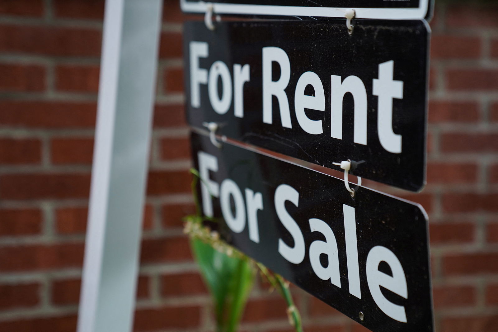 A "For Rent, For Sale" sign is seen outside of a home in Washington, July 7, 2022.