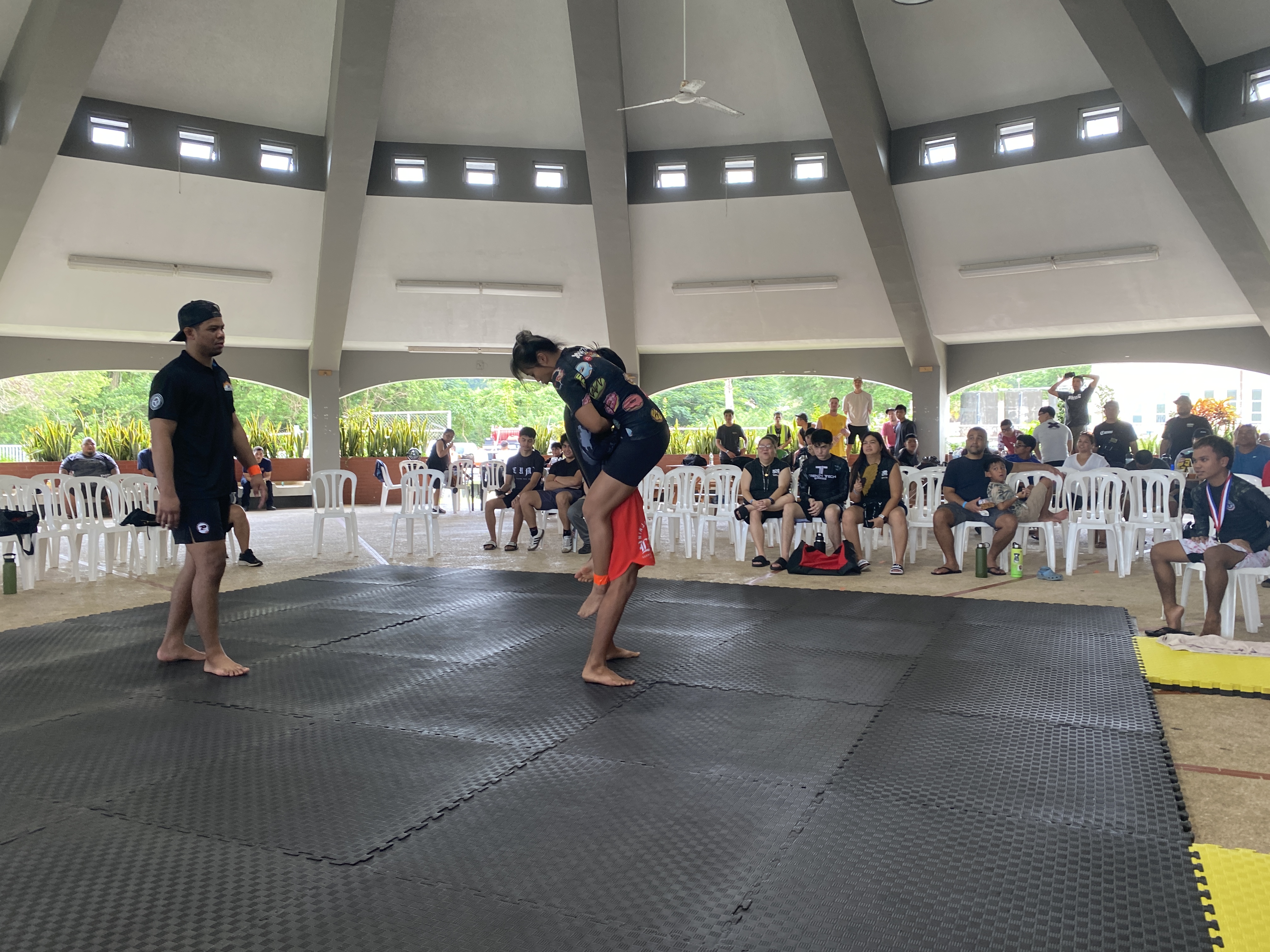 Jess Ma jumps into a guillotine in her match against Phil Simon​​.