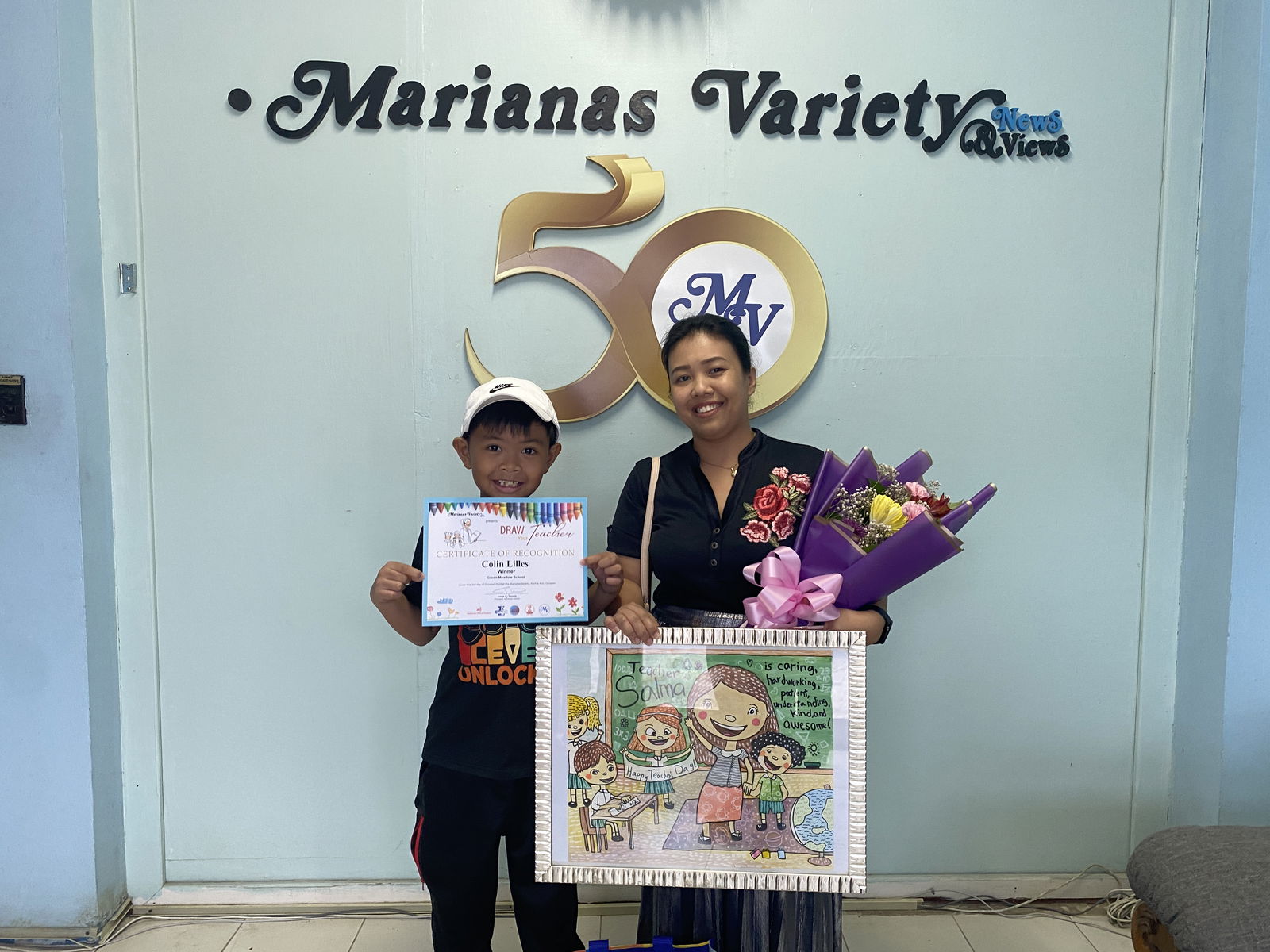 Colin Lilles, left, poses with his mother Nhorleen Lilles. Colin painted his teacher Salma Lapuz, who was not present for the photo taking. 