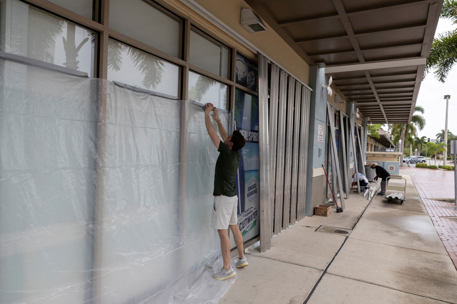 People board up businesses as Hurricane Milton approaches Fort Myers, Florida, Oct. 8, 2024.