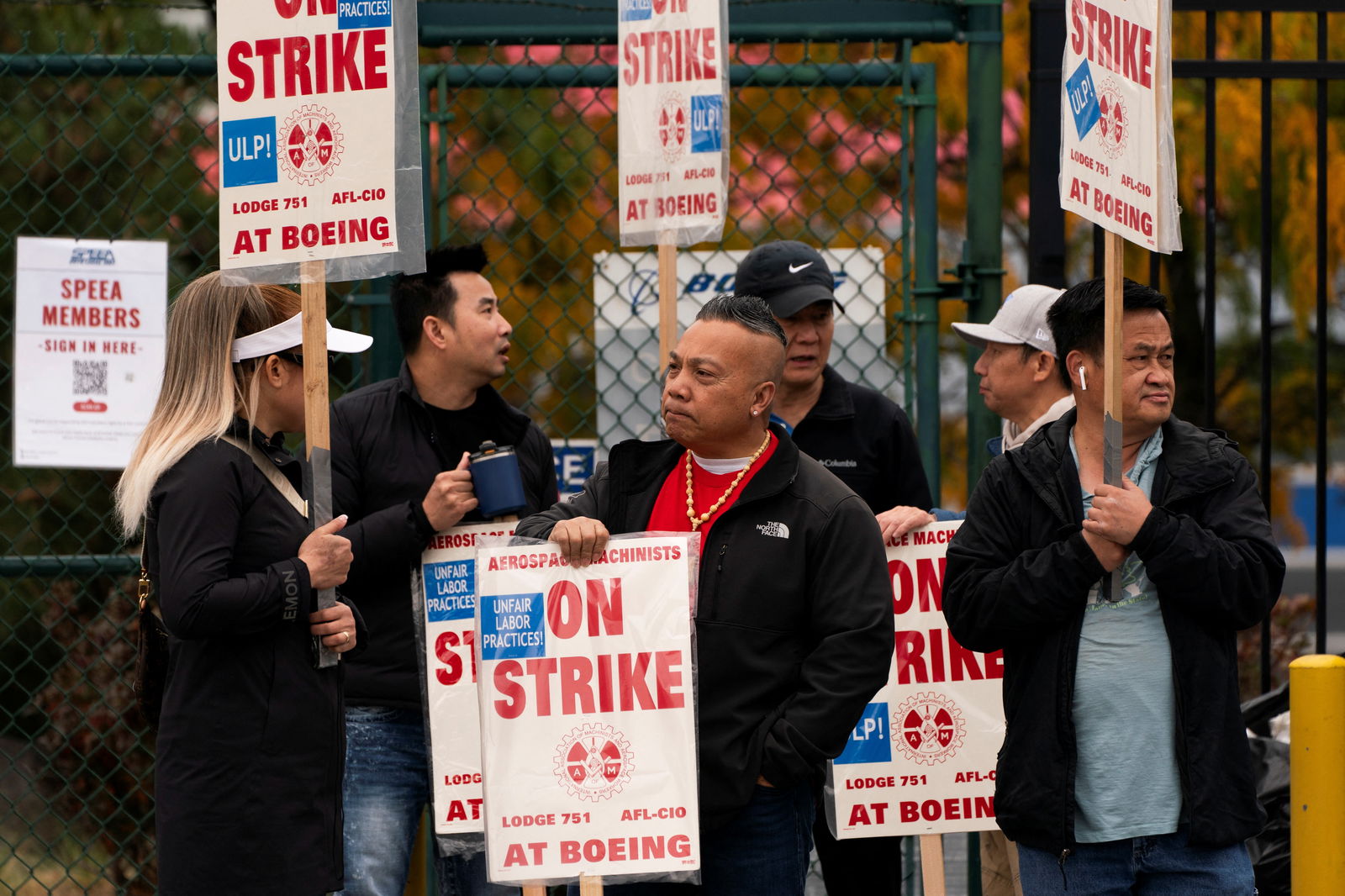 Boeing factory workers and supporters gather on a picket line near the entrance to a Boeing production facility in Renton, Washington, Oct. 11, 2024.
