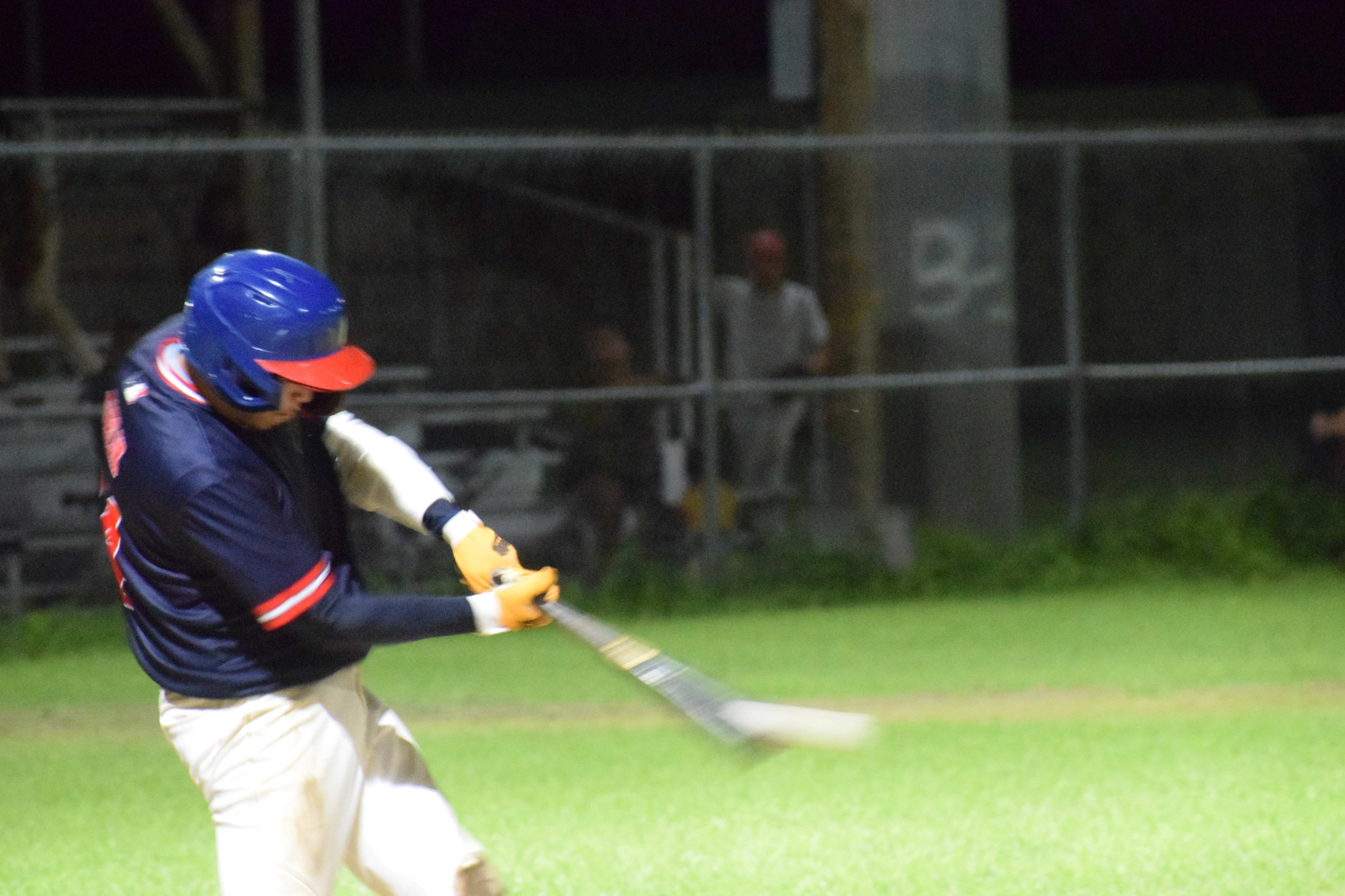 Cardinals' right fielder TJ Sablan hits the ball for an RBI double.