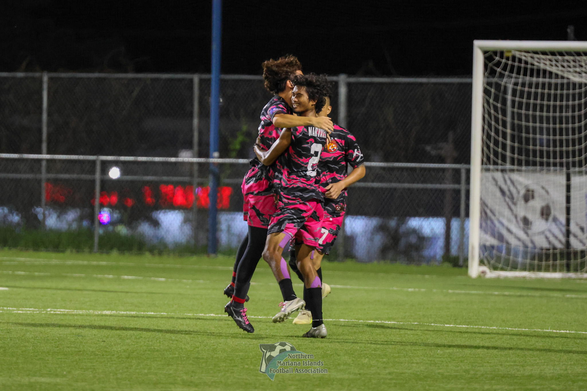 Ariel Narvaez and teammates celebrate after scoring a goal in a Marianas Soccer League 1 game at the NMI Soccer Training Center. 