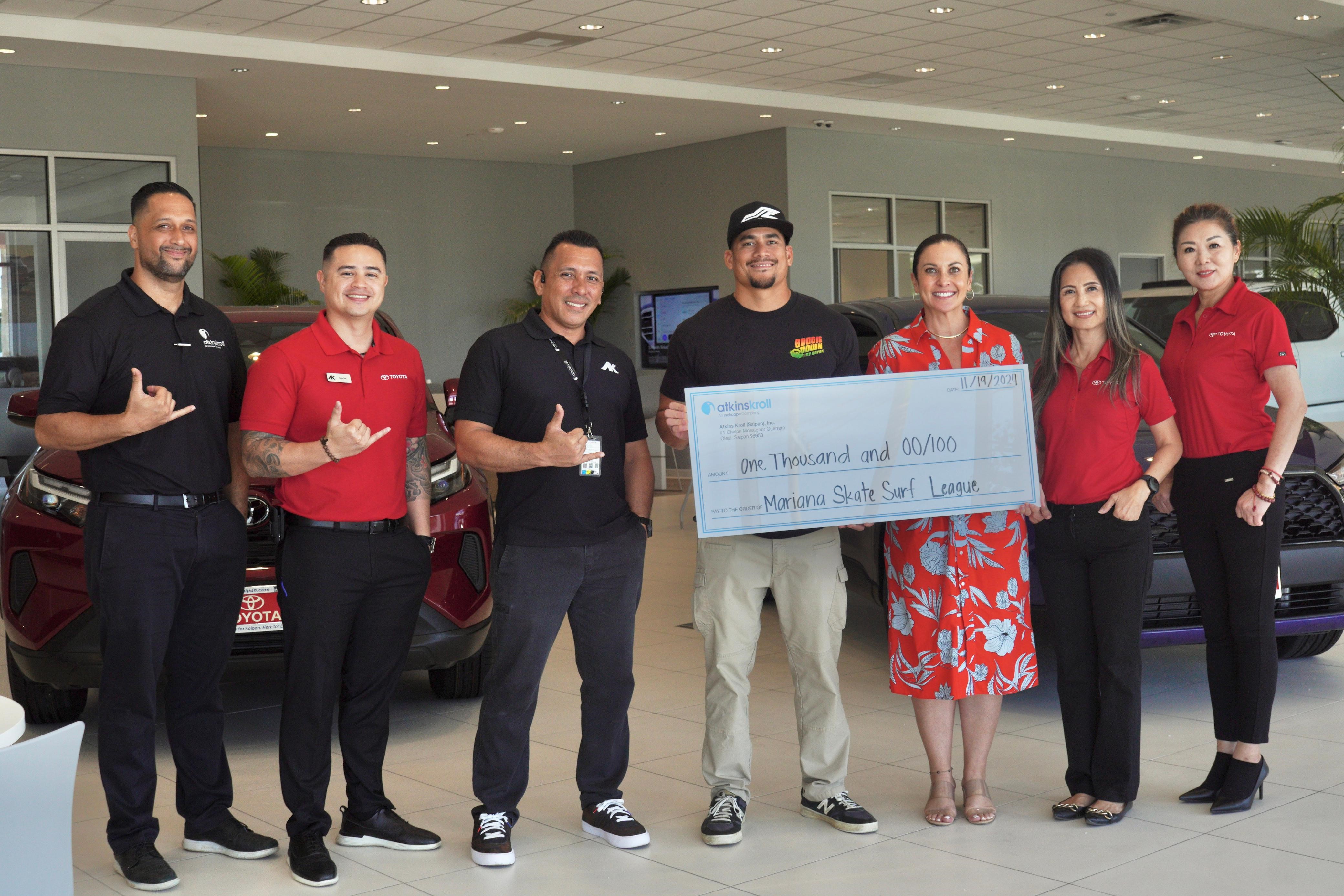 From left, Atkins Kroll Sales and Rental Manager Kevin Barnes, Toyota Sales Associate Kevin Ada, Aftersales Manager Vincent Tudela, Marianas Surf Skate League Chair Edward Manibusan, Atkins Kroll Saipan General Manager Tracy Guerrero, Toyota Sales Associate Liza Taylor, and Toyota Sales Associate Junping Woodruff.