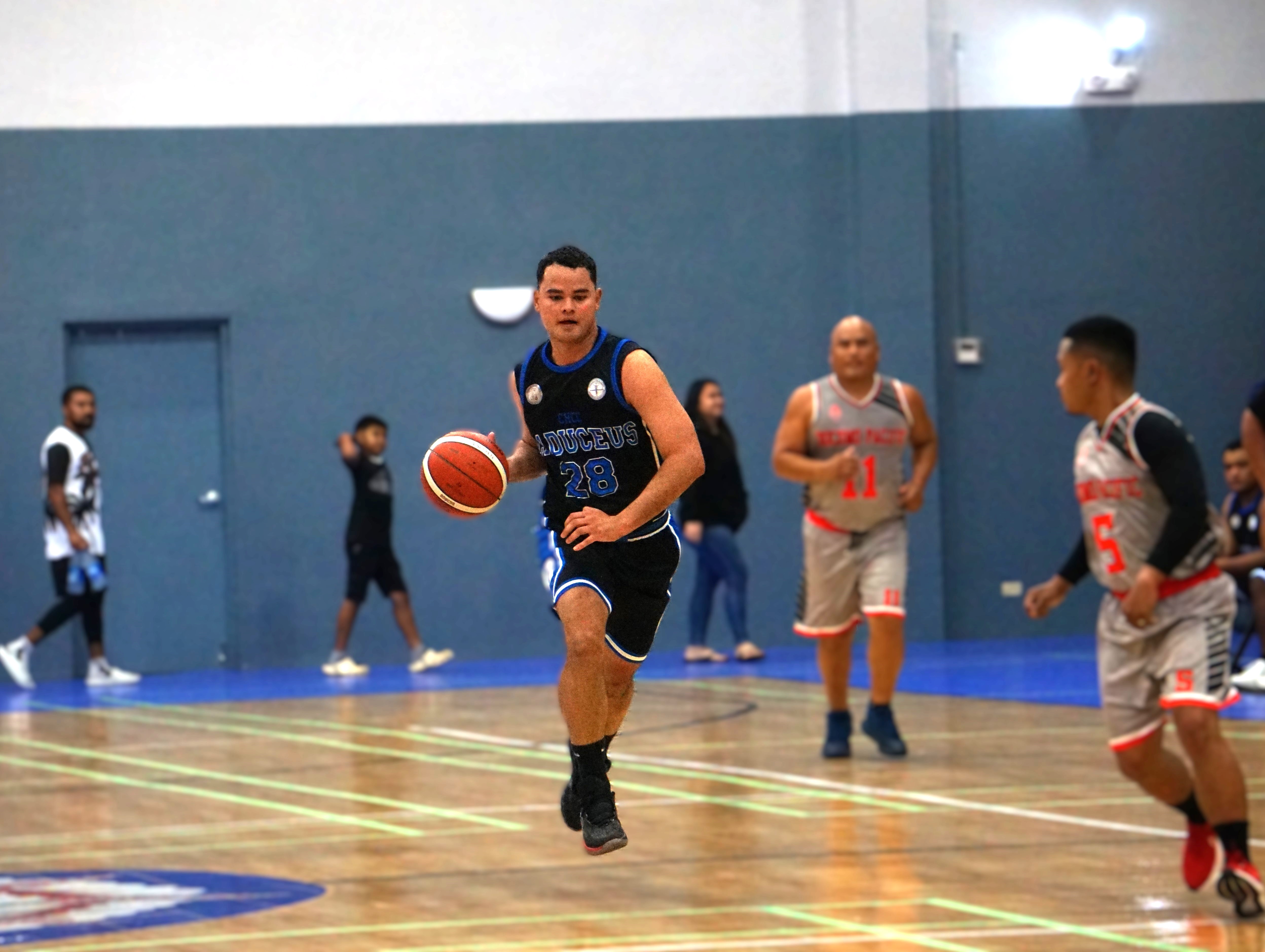 CHCC's James Phillips brings down the possession during a game in the 2024 R&J Wine and Liquor Inter-Government/Business League at the Ada gym.