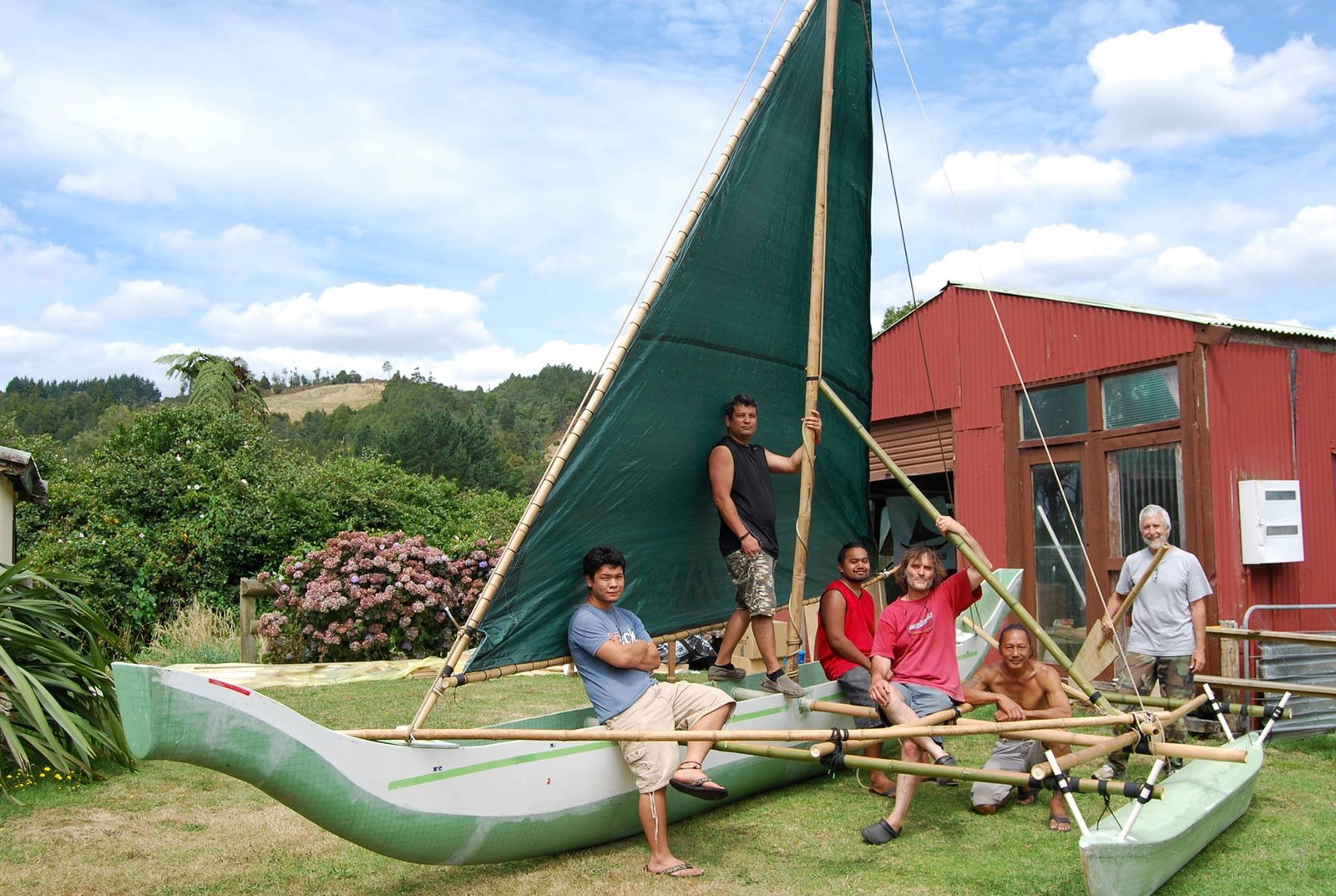  Neni was mostly fabricated in New Zealand by a 500 sails crew from Saipan and Guam under the direction of yacht builder Derek Kelsall. She is pictured here with the crew in New Zealand prior to being shipped to Saipan. 