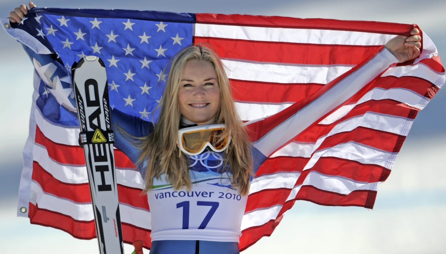 Bronze medalist Lindsey Vonn of the U.S. hold the Stars and Stripes at the Vancouver 2010 Olympics in Whistler, British Columbia, Canada, Feb. 20, 2010.