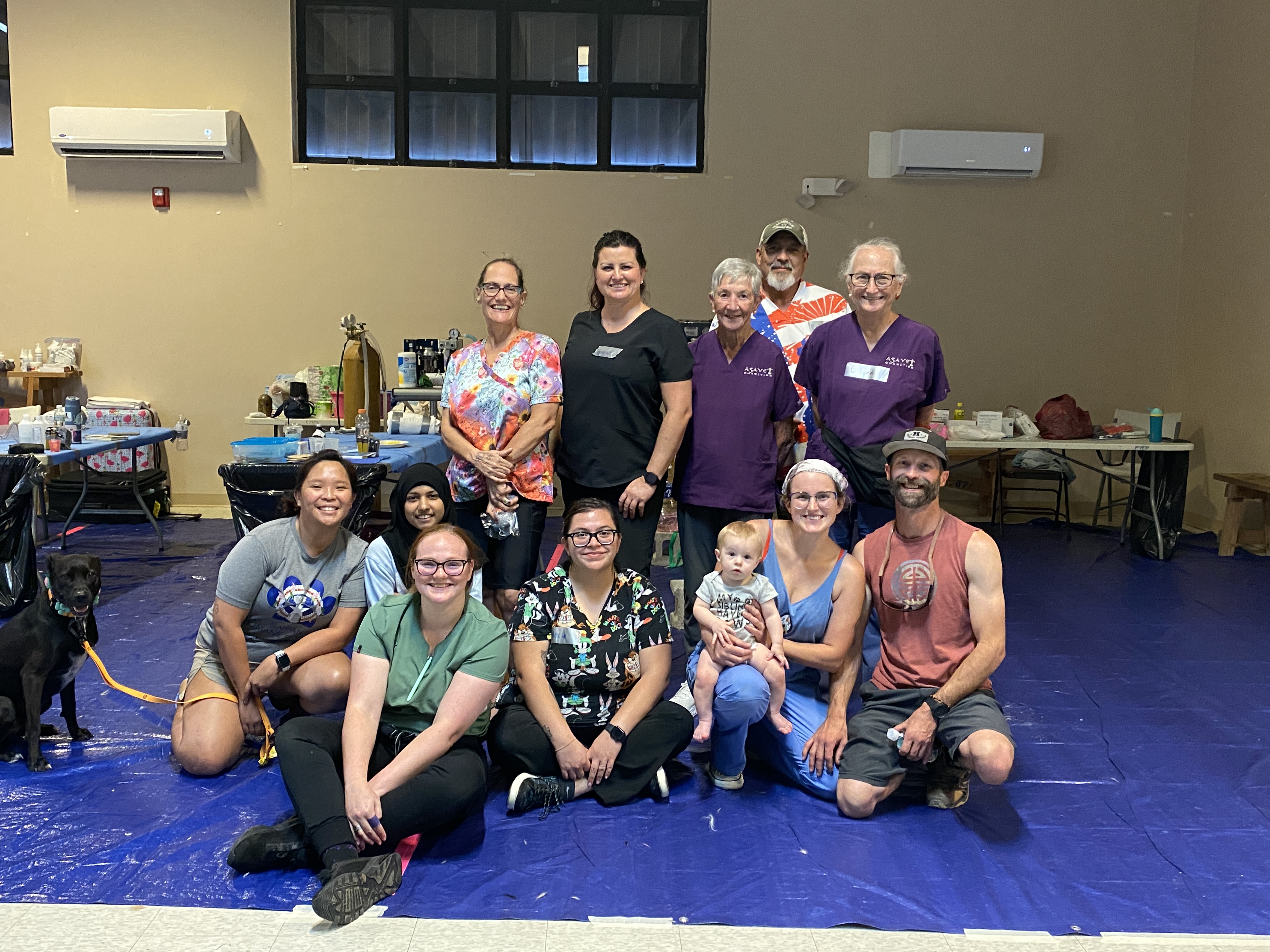 Alex Mays, front row, second from right, poses with the volunteers from Arizona who traveled with her for the Parker Project and Saipan Humane Society collaboration. Also in the photo is SHS clinic manager Ruby Ma, far left.