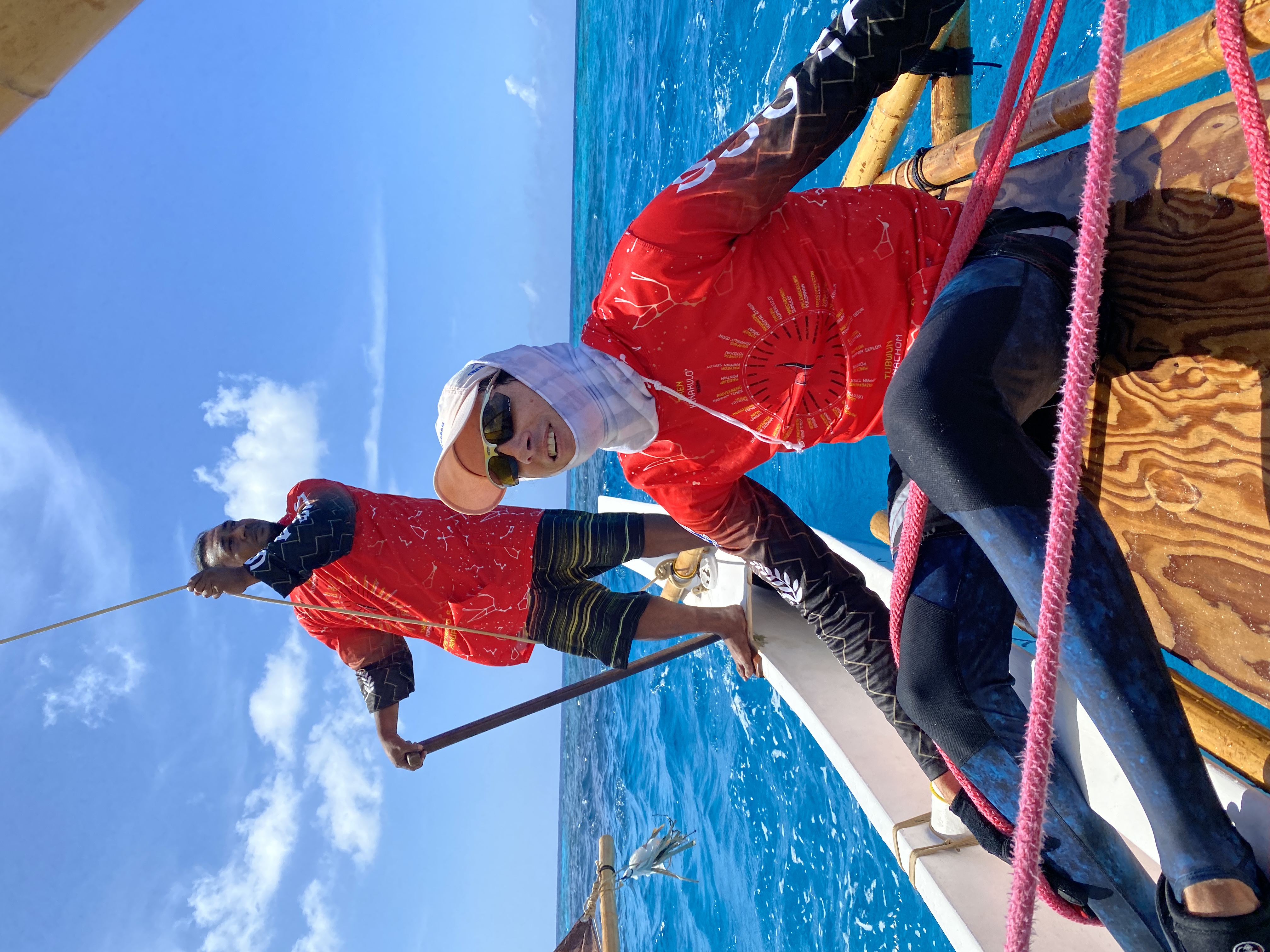 Sanjo Maras, standing, steers Aunty Oba and keeps a lookout ahead while Wilson Gaul mans the gigehi, or sheet. 