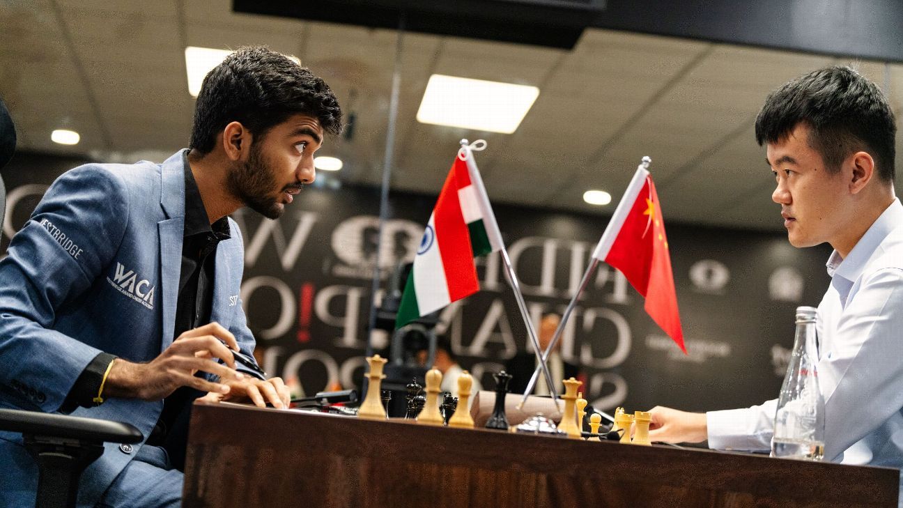D. Gukesh, left, the Indian challenger, speaks with world champion Ding Liren of China at the conclusion of game 2 of their world title match in Singapore on Tuesday, Nov. 26, 2024.