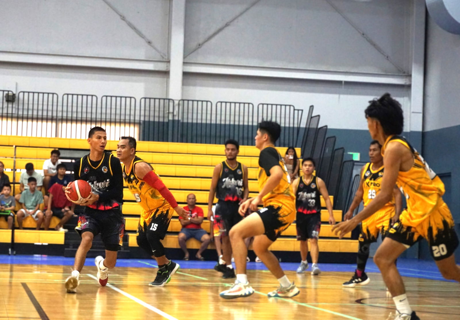 Akarri 1's Jon Diaz protects the ball as he looks for an open teammate during a game against K-Pro in the open division of the 2nd Saipan Magalahi Eagles Club – Saipan MagaHaga Lady Eagles Group Basketball Tournament at the Ada gym on Sunday. 