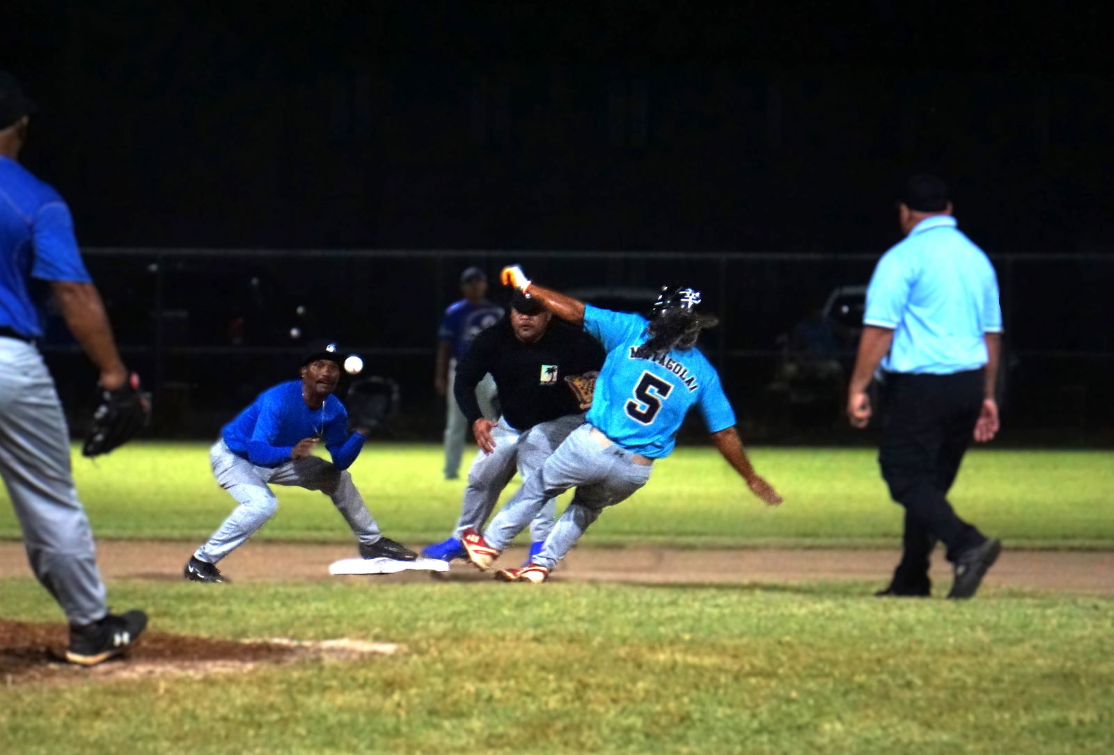Blue Jays' shortstop Shawn Matsutaro and second baseman Harlan Reyes rush to pick off an attempt to steal by Marlin's Roy Matagolai during a 2024 SBL Masters League game at the Francisco "Tan Ko" Palacios Baseball Field on Friday.