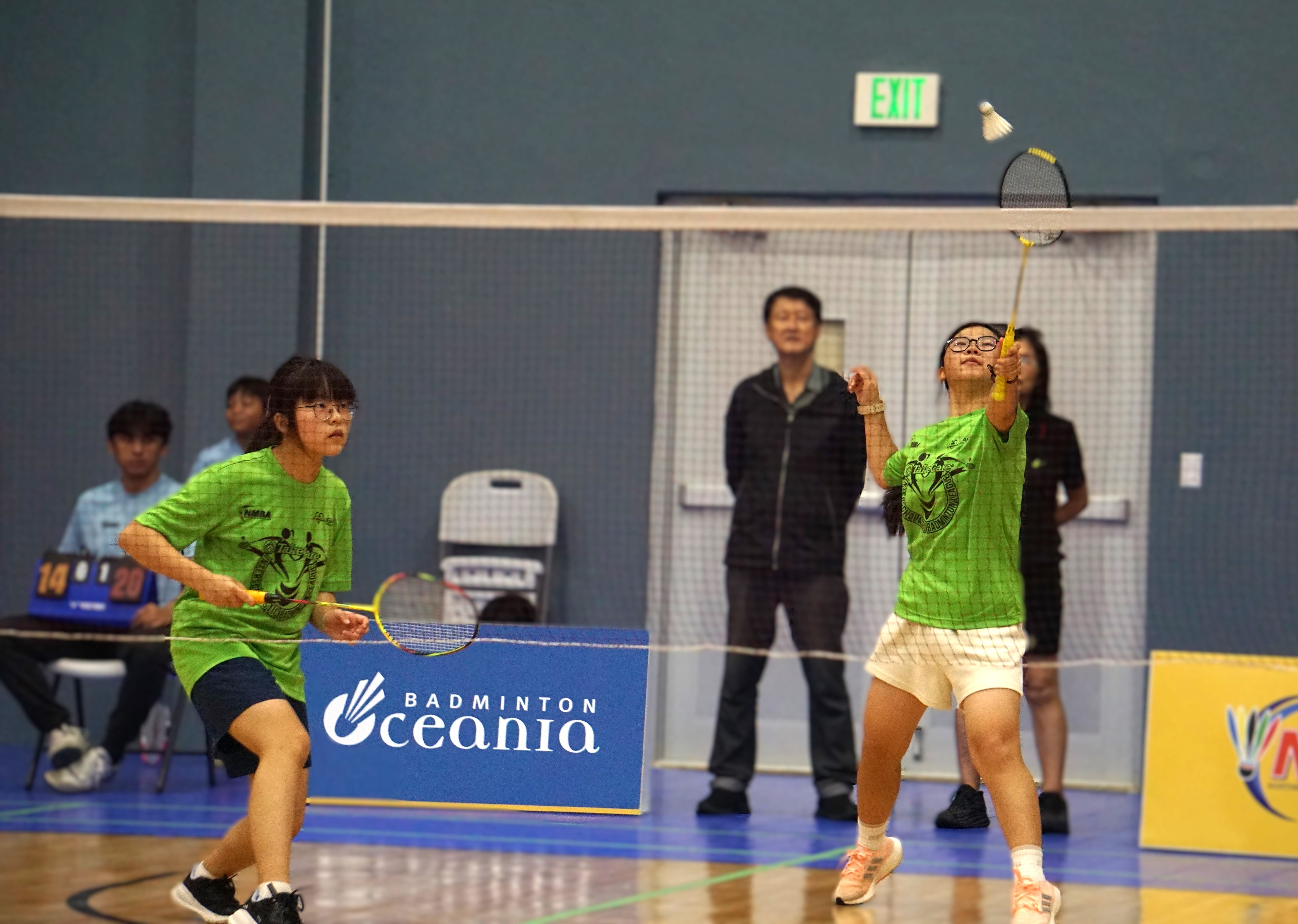 An ACS student reaches for the overhand return during a girls doubles match of the PSS-NMBA Interscholastic Badminton League SY24-25 at the Ada gym.