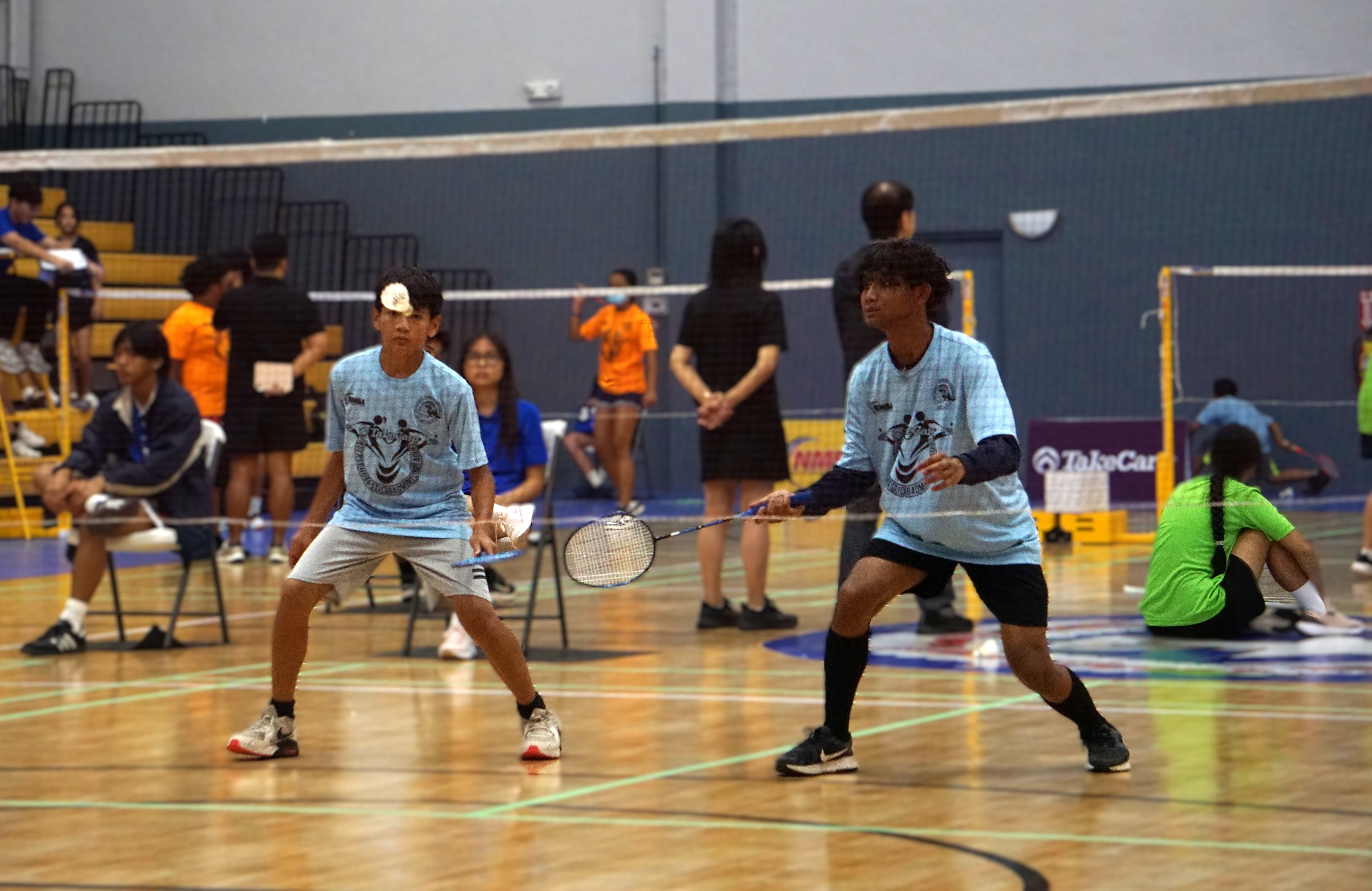 Hopwood Middle School players react to an incoming return during a boys doubles game in the co-ed middle school division of the PSS-NMBA Interscholastic Badminton League SY24-25 at the Ada gym on Saturday.