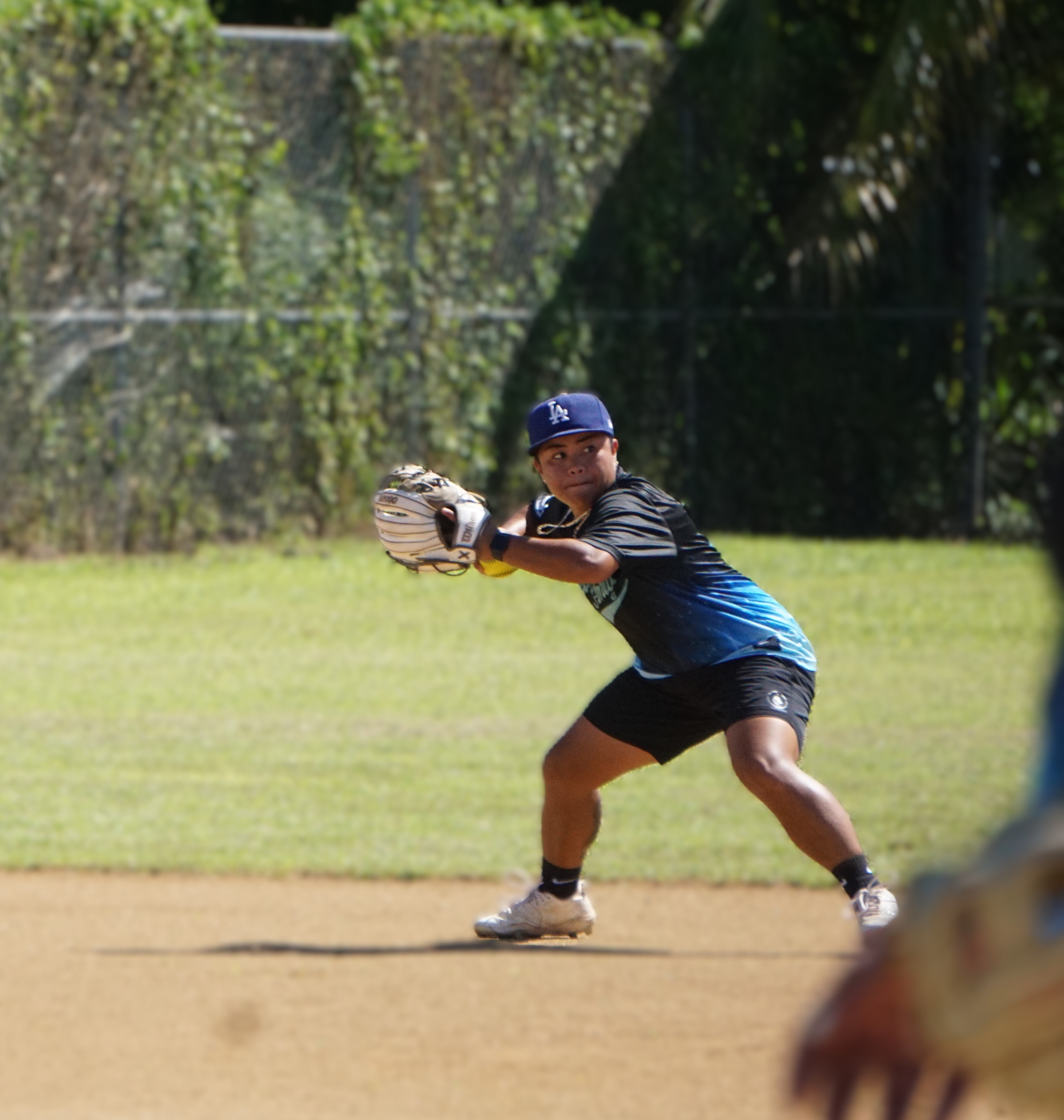 Man Amigas' Kiana Aldan winds up for a throw to first base in a pick-off attempt during a game against the 670 Babes for Fun in the inaugural NMI Softball Association Women’s League at the Miguel "Tan Ge" Pangelinan softball field on Saturday.