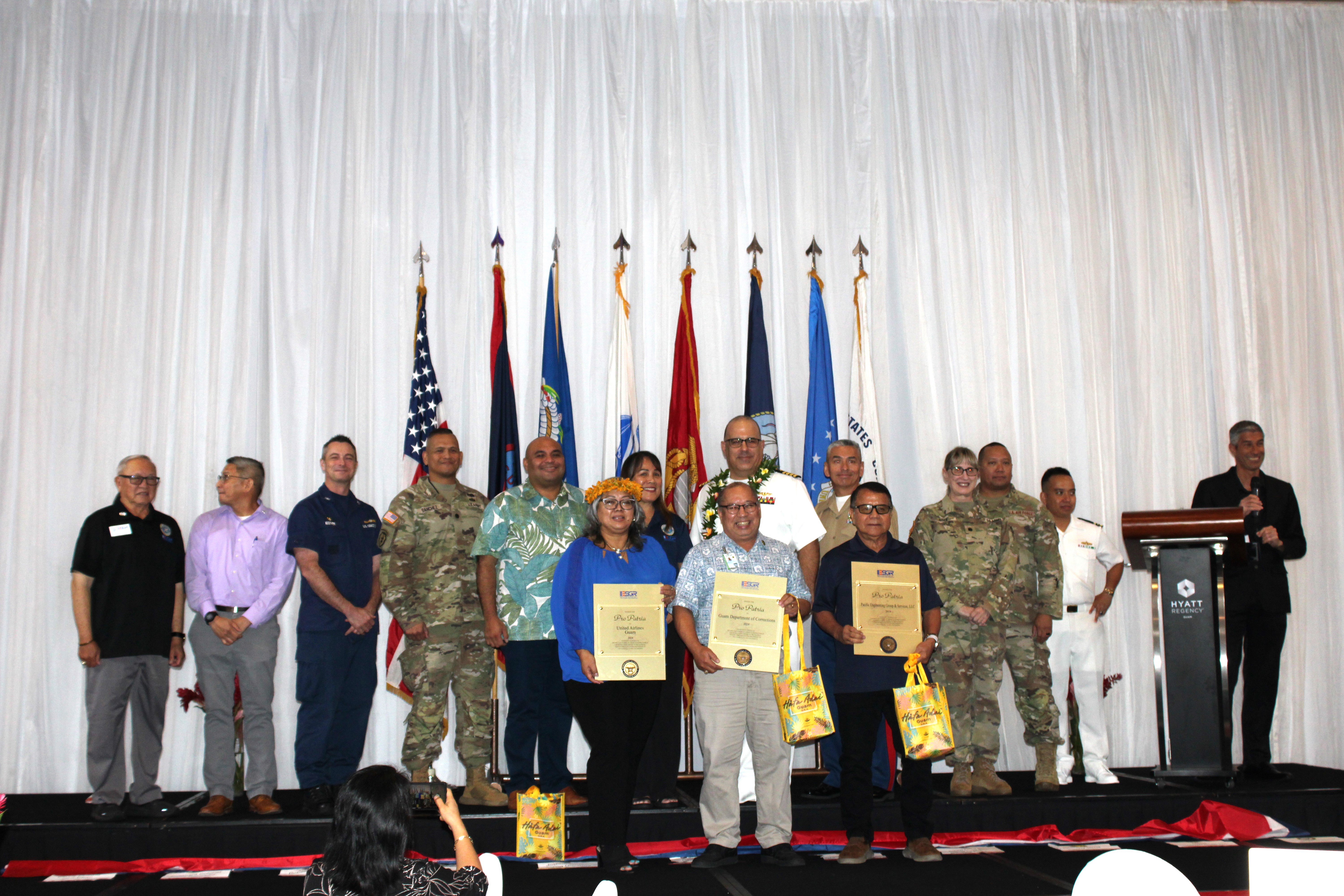 2024 Pro Patria Awards presented to the top three supportive and exemplary employers of service members in the Guard or Reserve. They are: United Airlines Guam, Pacific Engineering Group and Services, LLC and the Department of Corrections, Government of Guam. Front, from left: Thelma Blanco, Human Resources, United Airlines Guam; Fred Bordallo, Jr., Director, Department of Corrections; and Gregorio Castro, President & CEO, Pacific Engineering Group and Services, LLC. Back, from left: Retired U.S. Army Major General Benny M. Paulino, GU-CNMI Vice Chair; Lieutenant Colonel Victor Balajadia, Director of Staff, Guam Air National Guard; Captain Robert Kistner, U.S. Coast Guard; Lieutenant Colonel Romeo Sanchez, 1st-294th Infantry Battalion, Guam Army National Guard: Acting Governor Joshua Tenorio; CathyAnn C. Gogue, GU-CNMI State Chair, U.S. Navy Captain Craig S. Der Ananian, Navy Readiness and Mobilization Command, San Diego; Colonel Ernest Govea, Commanding Officer, Marine Corps Base Camp Blaz, U.S. Marine Corp.; Lieutenant Colonel Penny Sima, U.S. Army Reserve; Major Benjamin Guerrero, U.S. Air Force Reserve; and Lieutenant Commander Brian Matic, U.S. Navy Reserve.