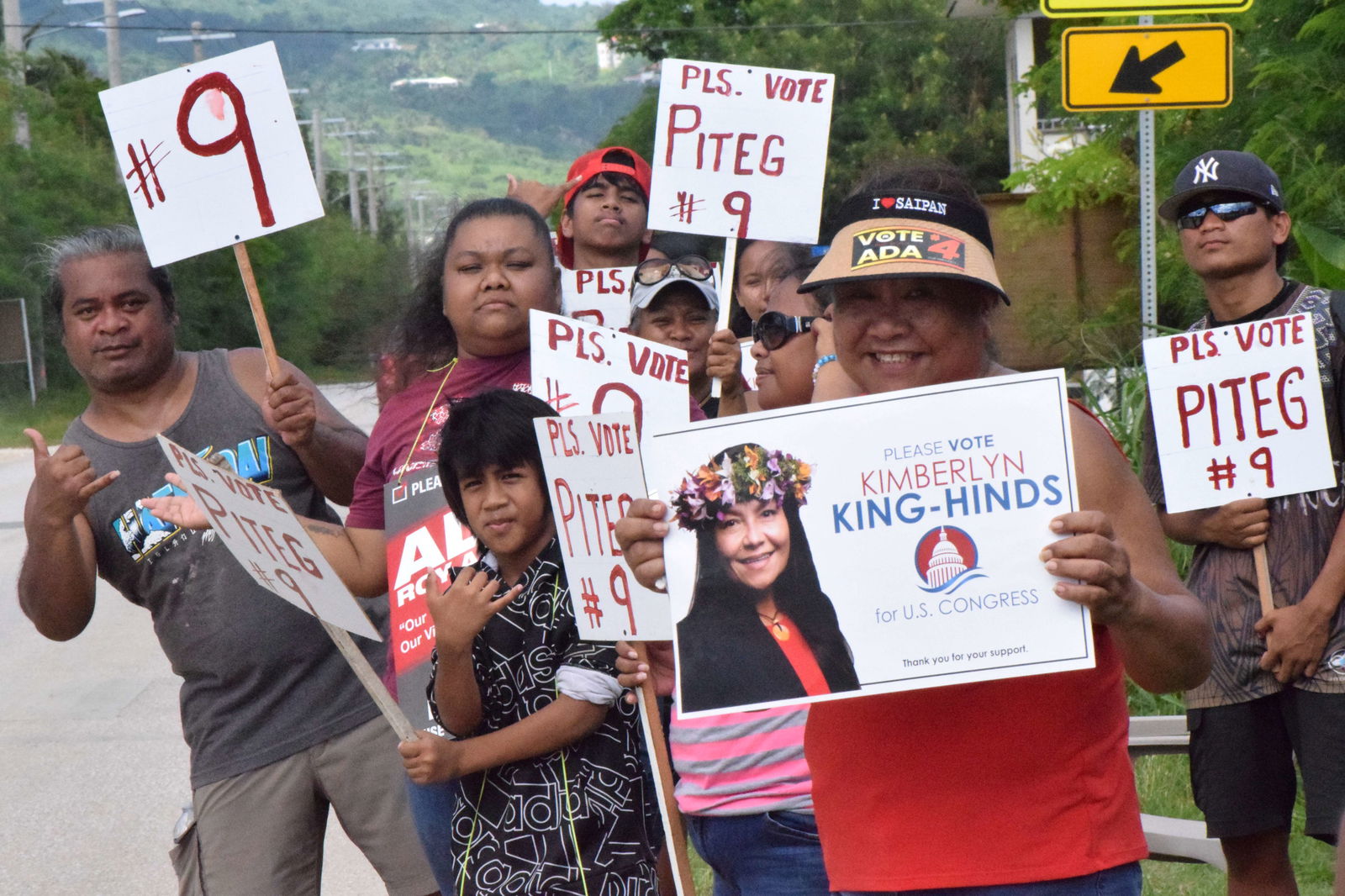 Lucy Aldan campaigns for U.S. delegate candidate Kimberlyn King-Hinds with the family members of Precinct 1 House candidate Benusto Piteg on Dandan Road.