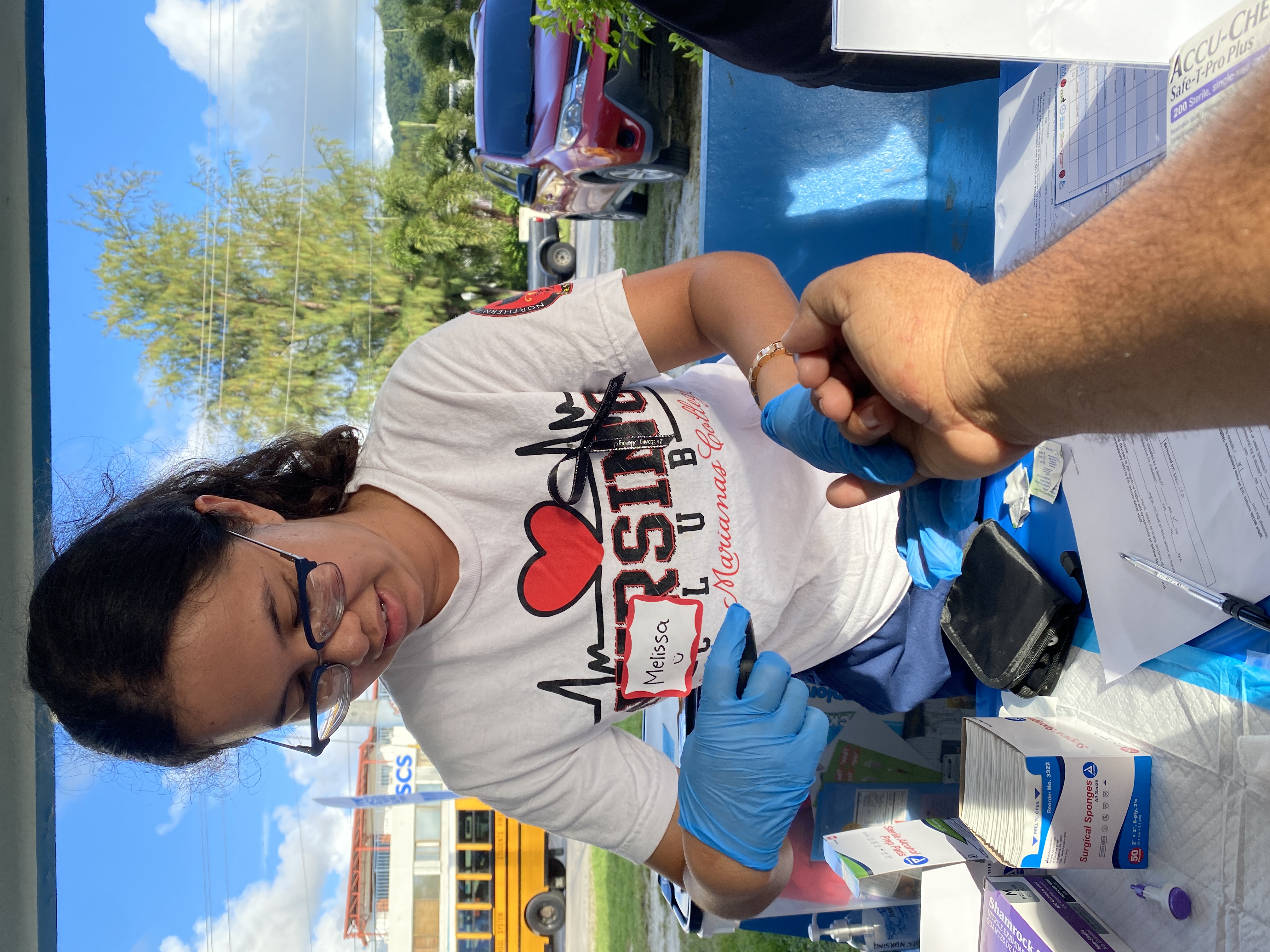 An NMC Nursing Club student takes this reporter’s blood sugar reading.