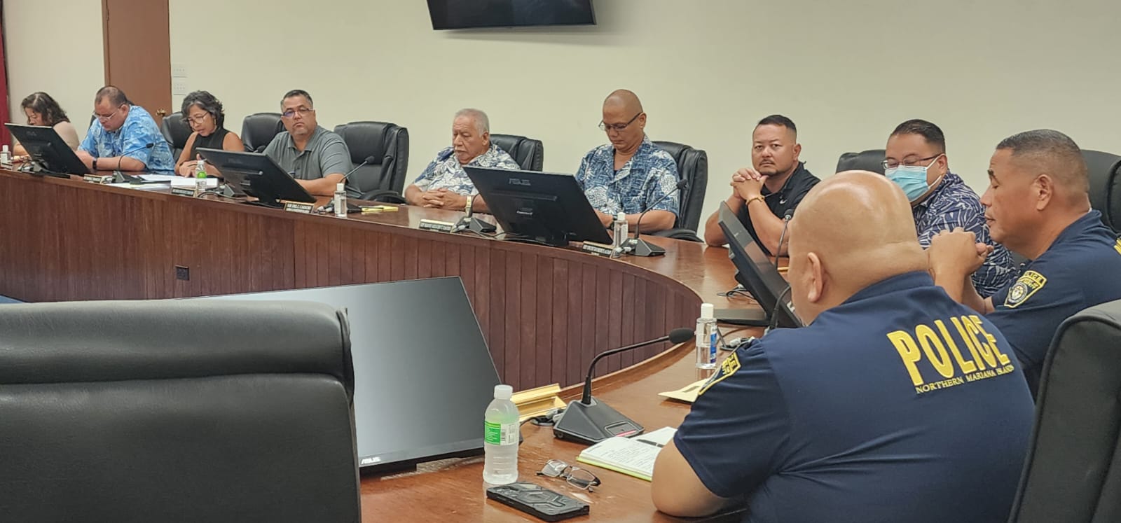 Department of Public Safety Commissioner Anthony Macaranas, right, and Assistant Police Chief Joe Saures meet with House members on Wednesday.