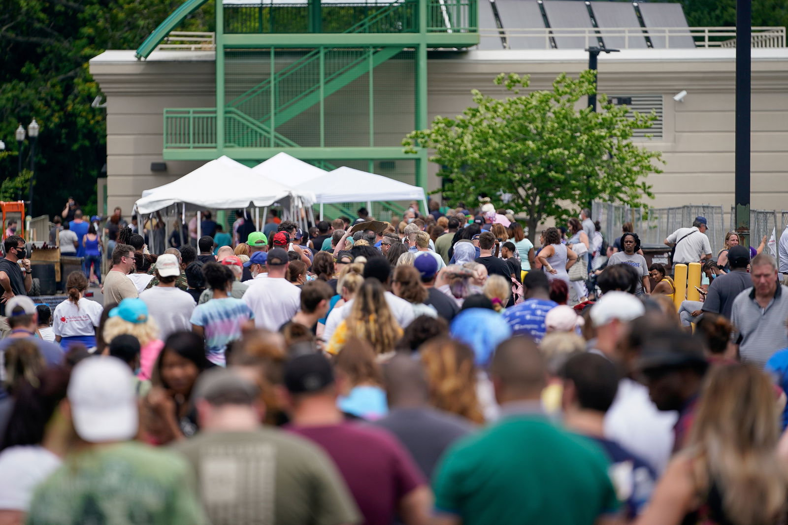 Thousands line up outside a temporary unemployment office established by the Kentucky Labor Cabinet at the State Capitol Annex in Frankfort, Kentucky, June 17, 2020.