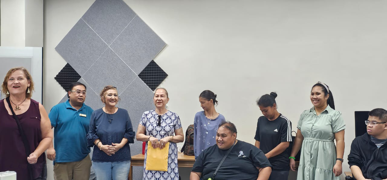 First Lady Wella Palacios, center, First Lady Wella Palacios Foundation President Becky P. Cruz, third left, and Center for Living Independently Director Susan Satur, left, with CLI consumers during a Thanksgiving luncheon at CLI on Capital Hill Wednesday.