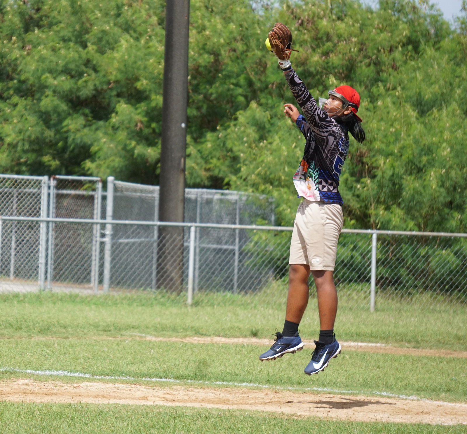 Hopwood pitcher Jesse Santos secures the ball during an opening game against Francisco M. Sablan Middle School in the boys middle school division of the PSS-SBL Interscholastic Fastpitch Softball League SY24-25 at the Dandan softball field on Saturday.